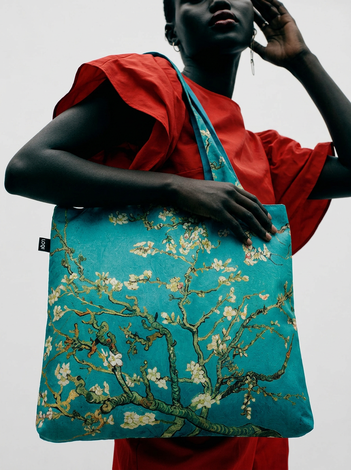 Van Gogh Almond Blossom foldable shopper bag carried by model in red outfit – museum art gift from ArtyGifts