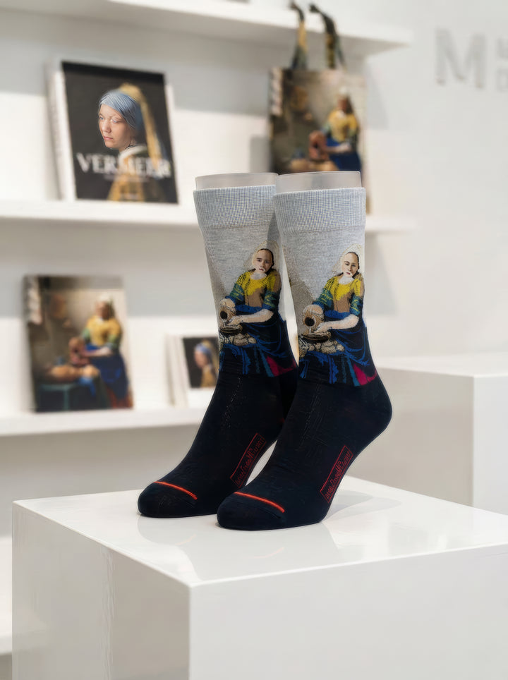 Museum art gift displayed with Vermeer print
