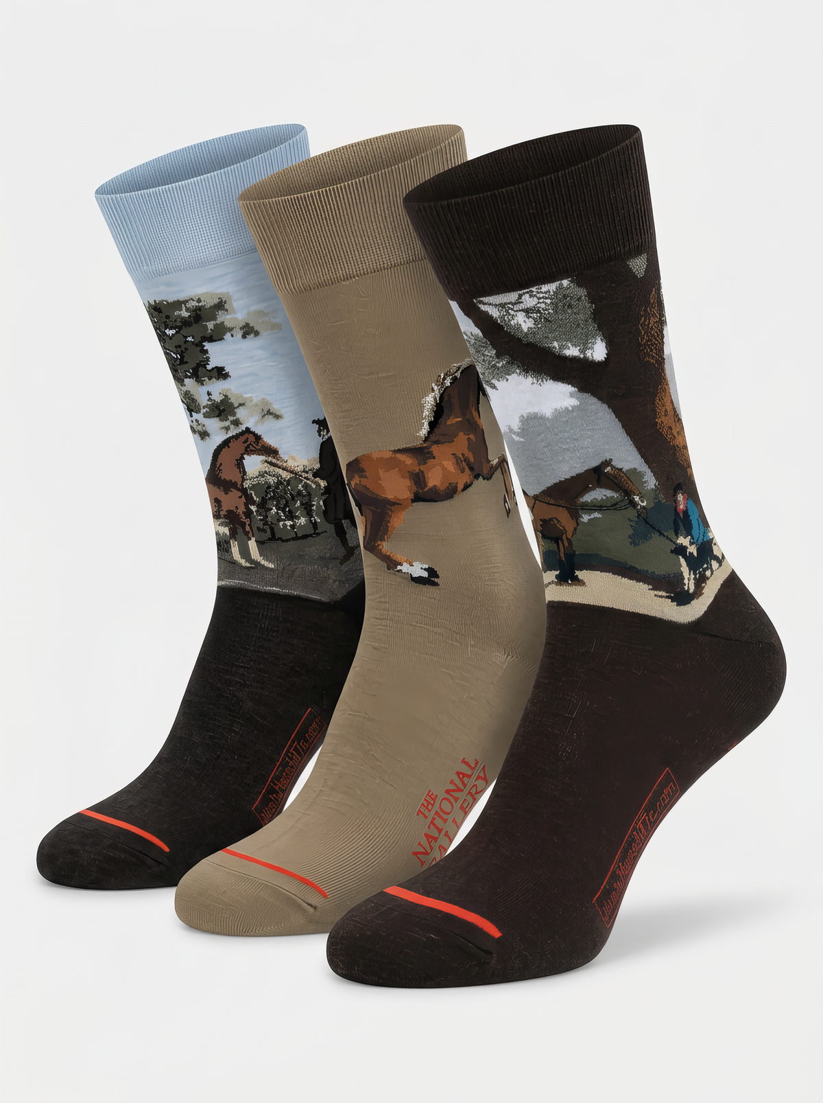 Three ArtyGifts socks in charcoal, taupe and dark colourways, featuring Whistlejacket, Horse Nurse With The Arab Horse Lord Grosvenor and The Third Duke of Dorset’s Hunter by George Stubbs.
