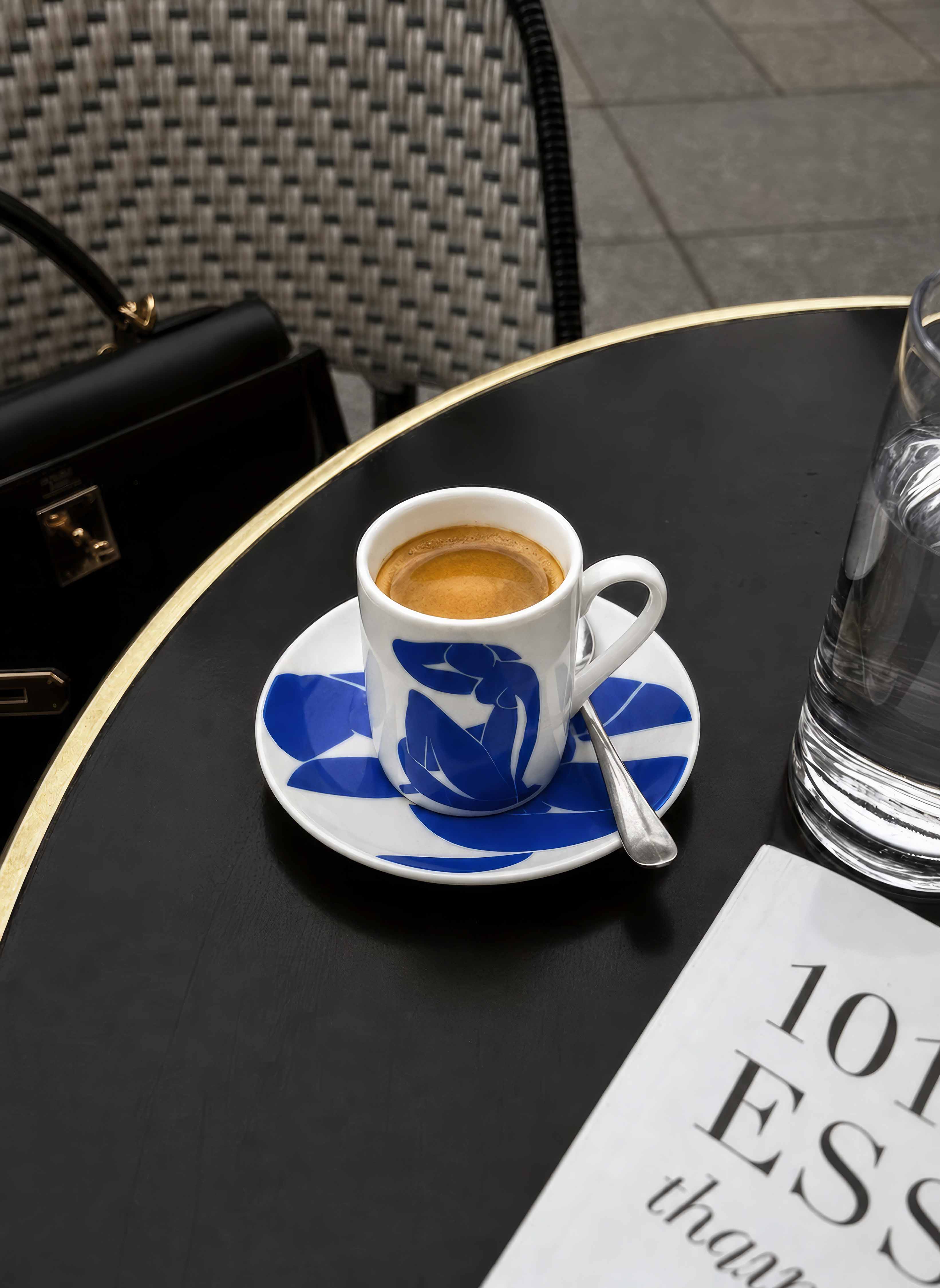 ArtyGifts espresso cup The Blue Figure by Henri Matisse on dark table – lifestyle shot