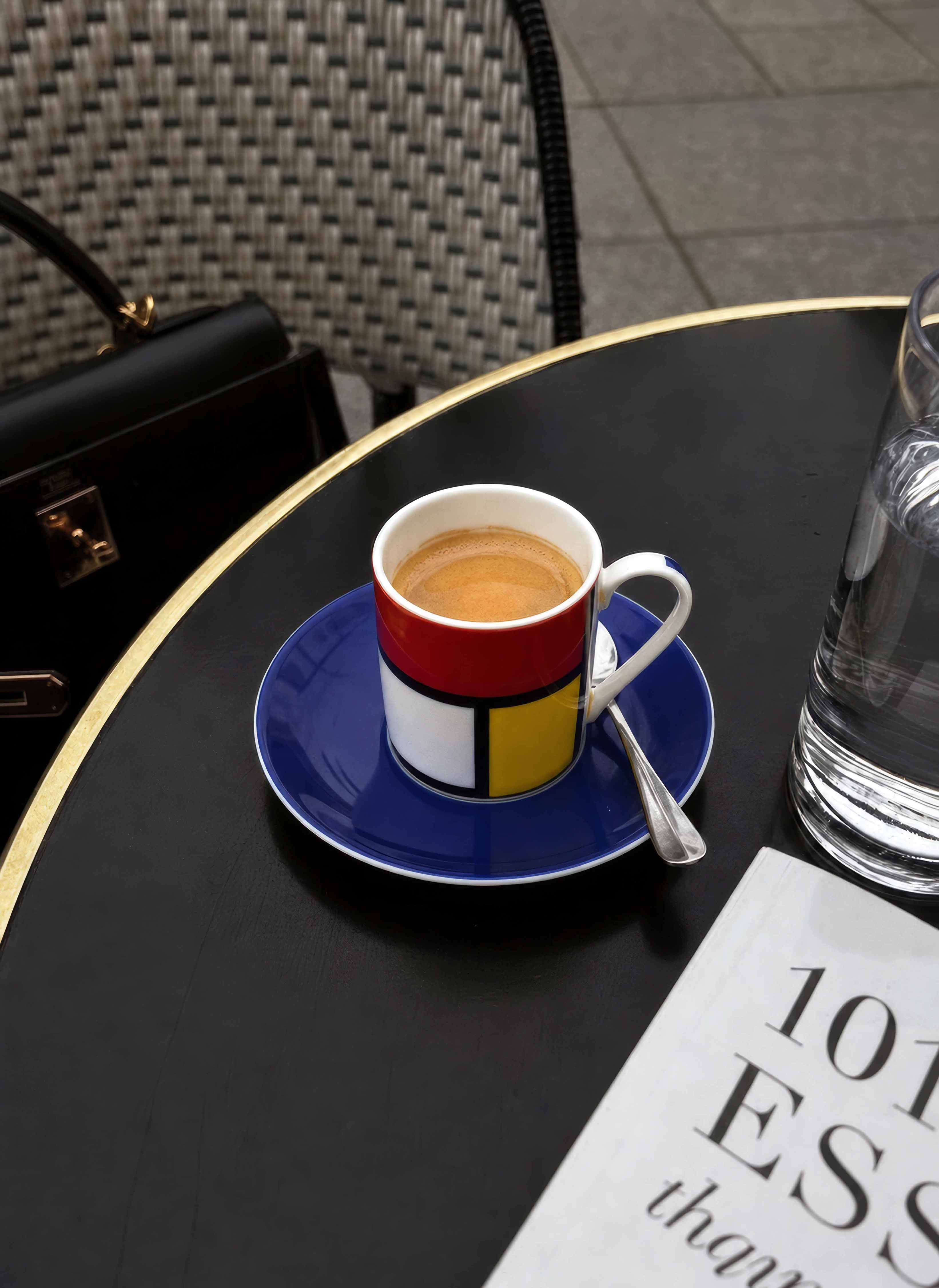 ArtyGifts espresso cup Composition by Piet Mondrian on dark table – lifestyle shot