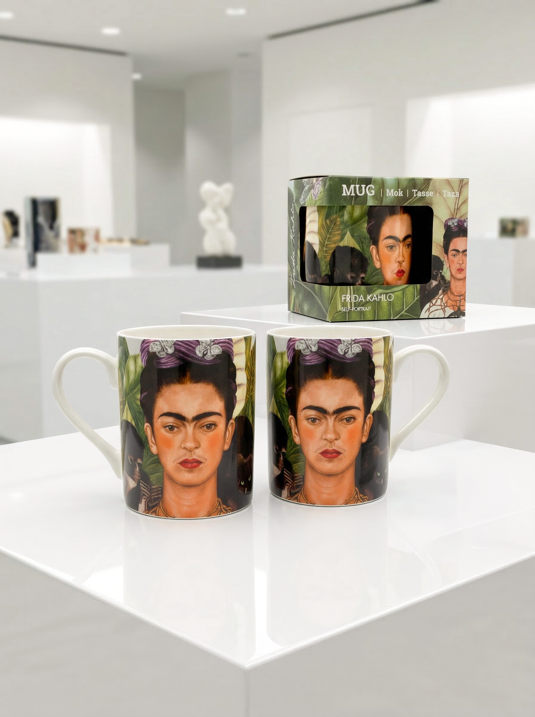 Two porcelain mugs with the Self Portrait design by Frida Kahlo displayed in a museum shop — ArtyGifts
shop