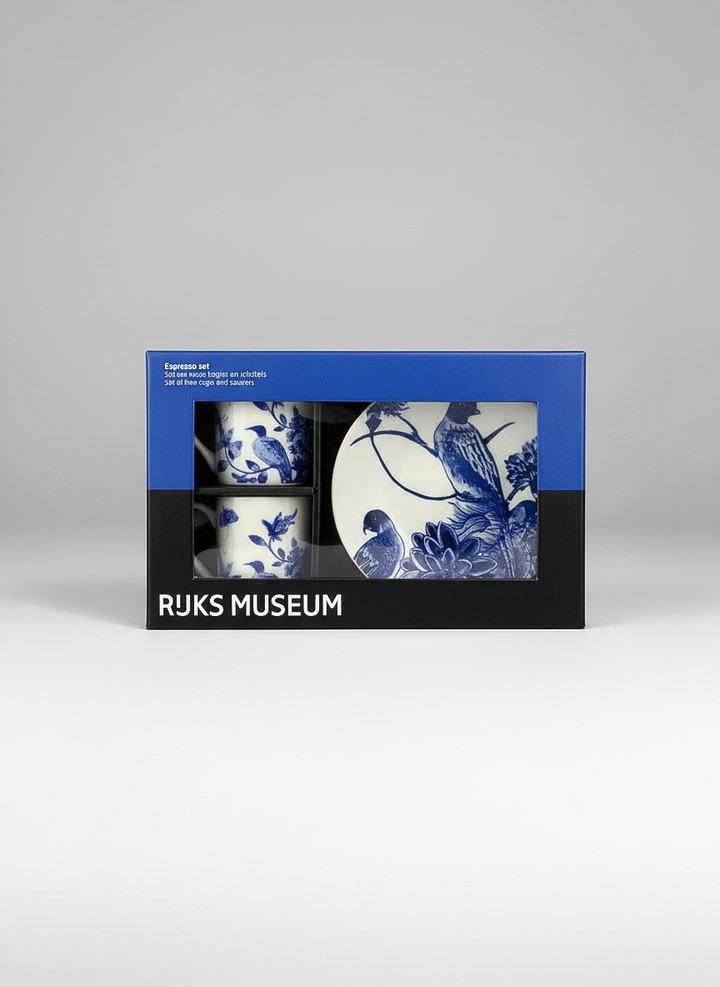 Packaged set of blue and white ceramic items with Rijksmuseum branding on a gray background