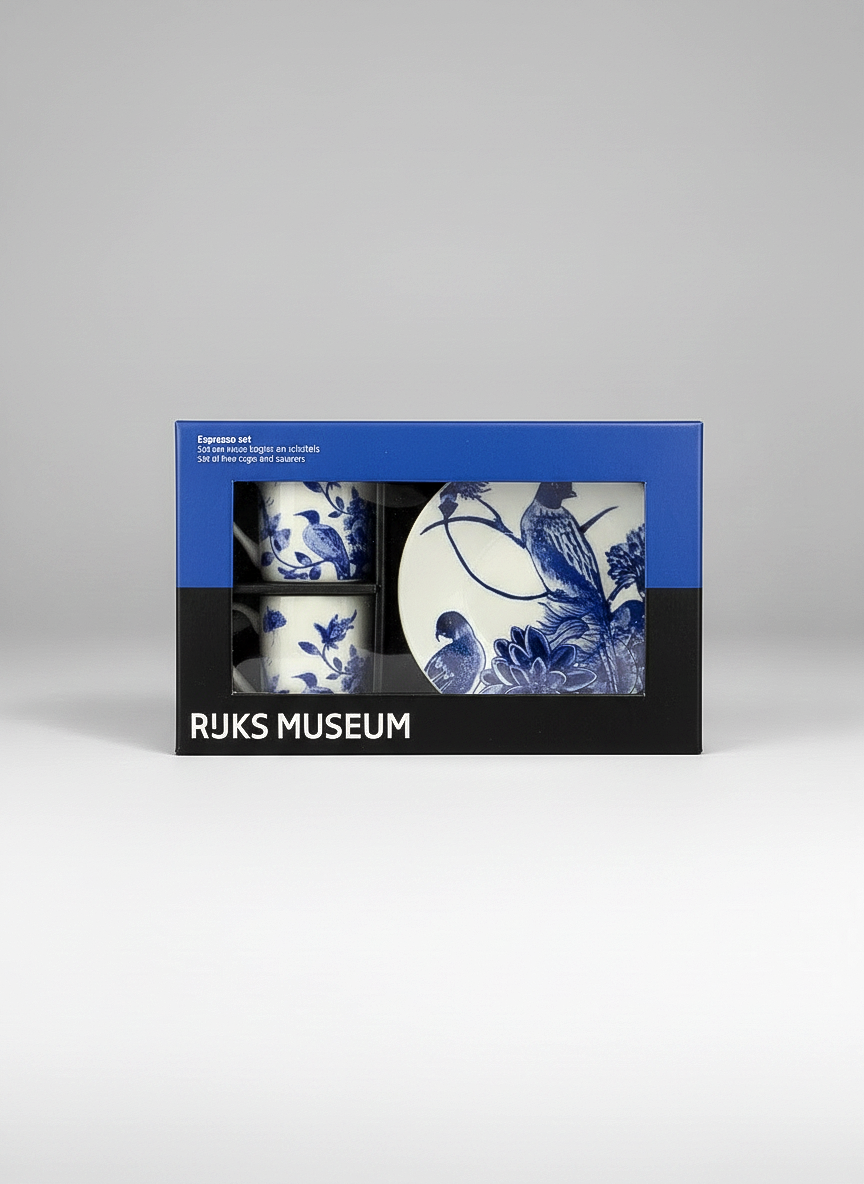 Packaged set of blue and white ceramic items with Rijksmuseum branding on a gray background