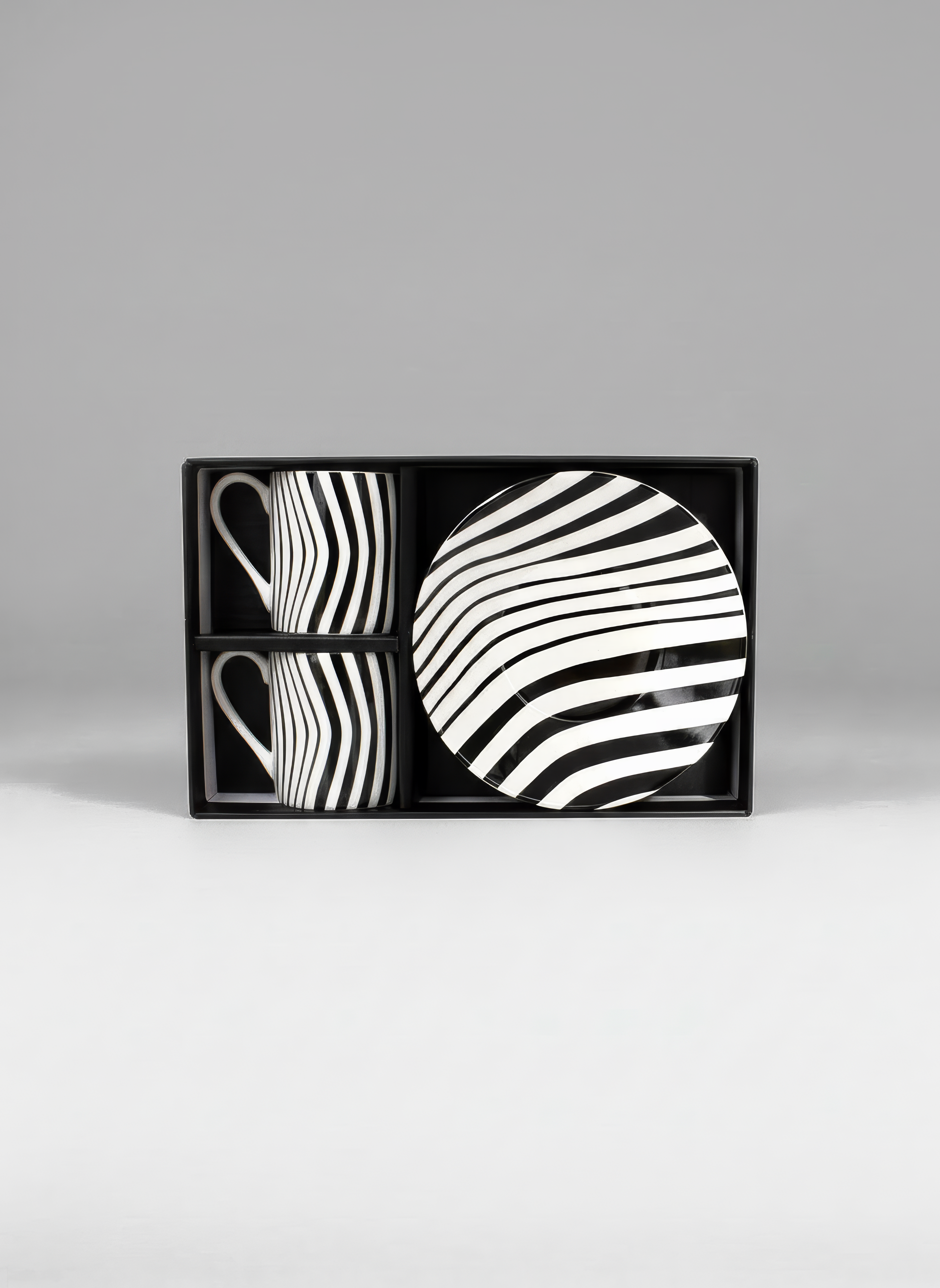 Optical Art espresso set gift box front view — black and white stripe pattern, museum gift by ArtyGifts
