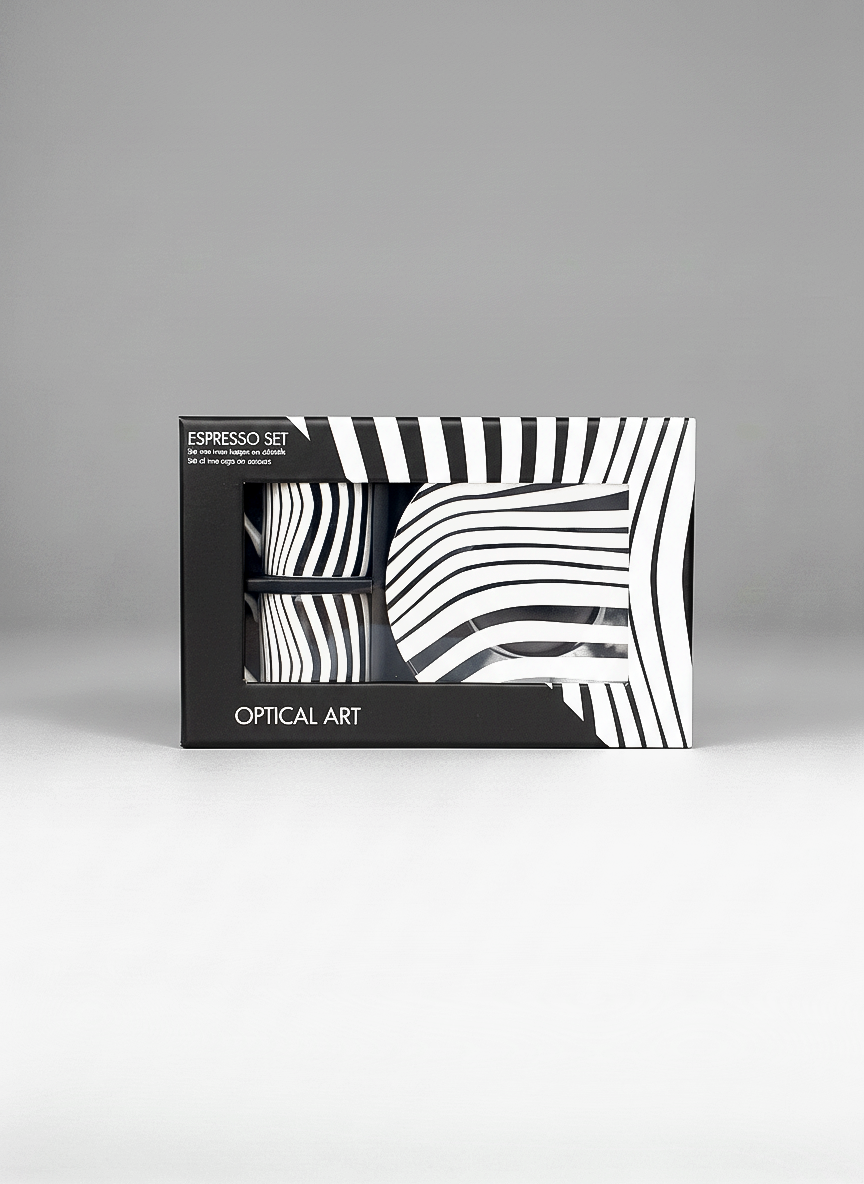 Packaged espresso set with black and white abstract design on a gray background