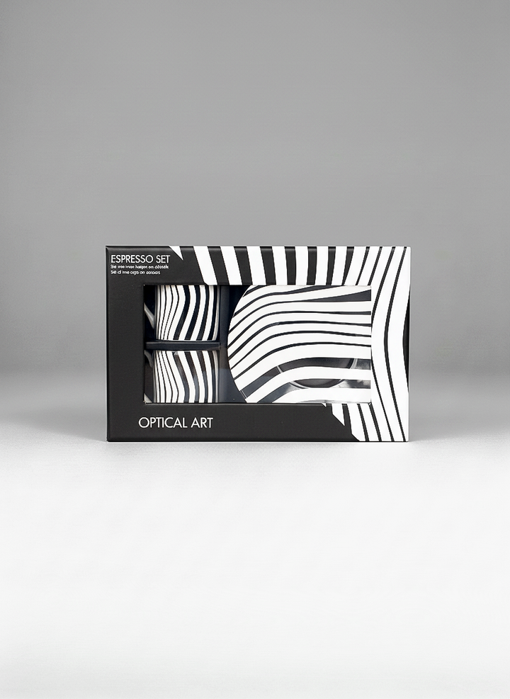 Packaged espresso set with black and white abstract design on a gray background