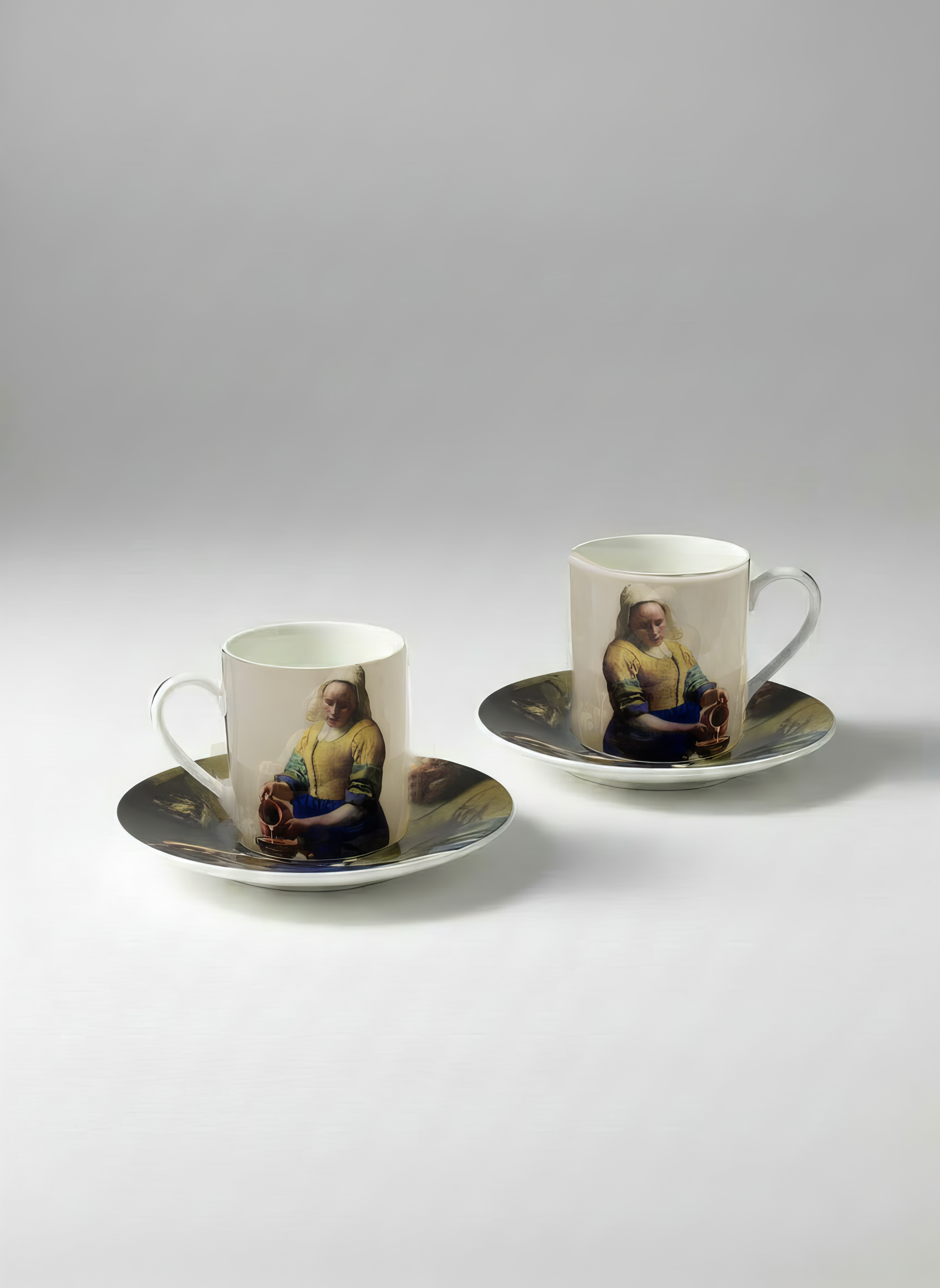 Espresso cup and saucer with The Milkmaid print by Johannes Vermeer on white background — ArtyGifts
