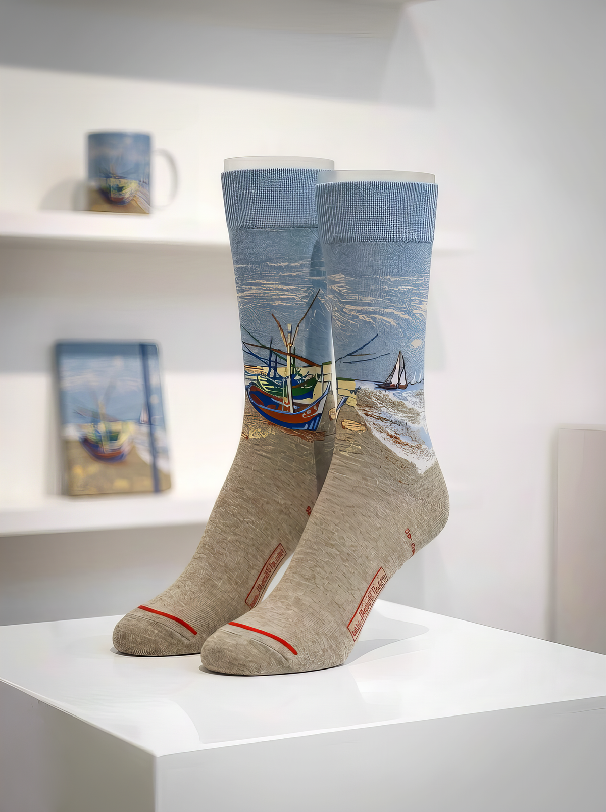  Fishing Boats on the Beach art socks by Vincent van Gogh displayed on a white pedestal