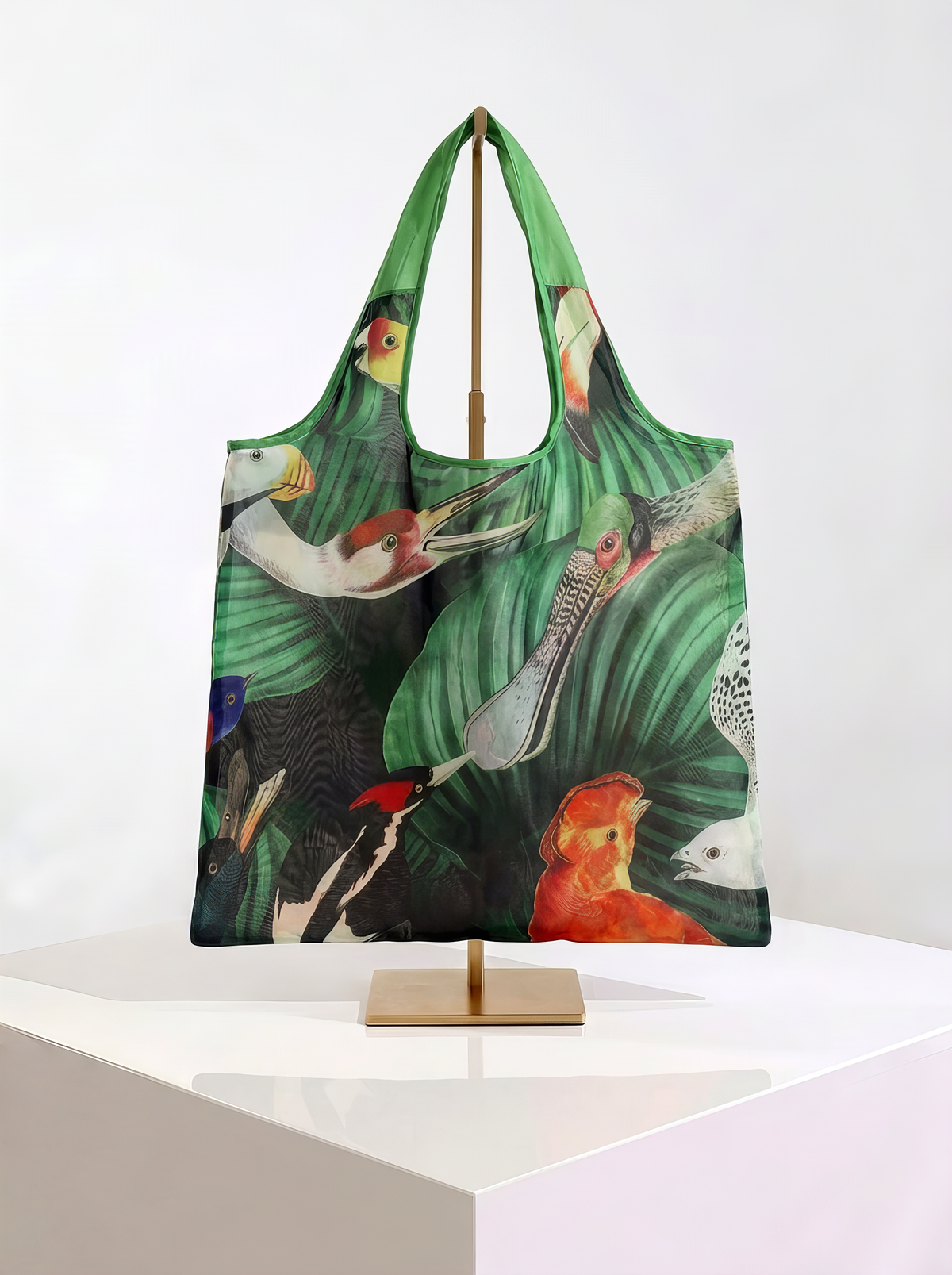 Foldable museum art shopper bag featuring Bird Life from the Teyler Museum collection, displayed on a gold stand against a white museum-style background from ArtyGifts
