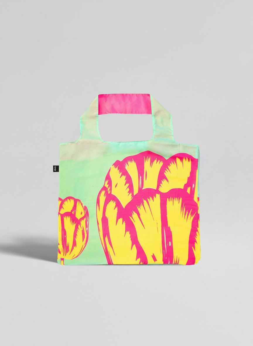 Foldable Shopper Bag Modern Tulip Yellow – woman carrying art bag on the street | ArtyGifts
