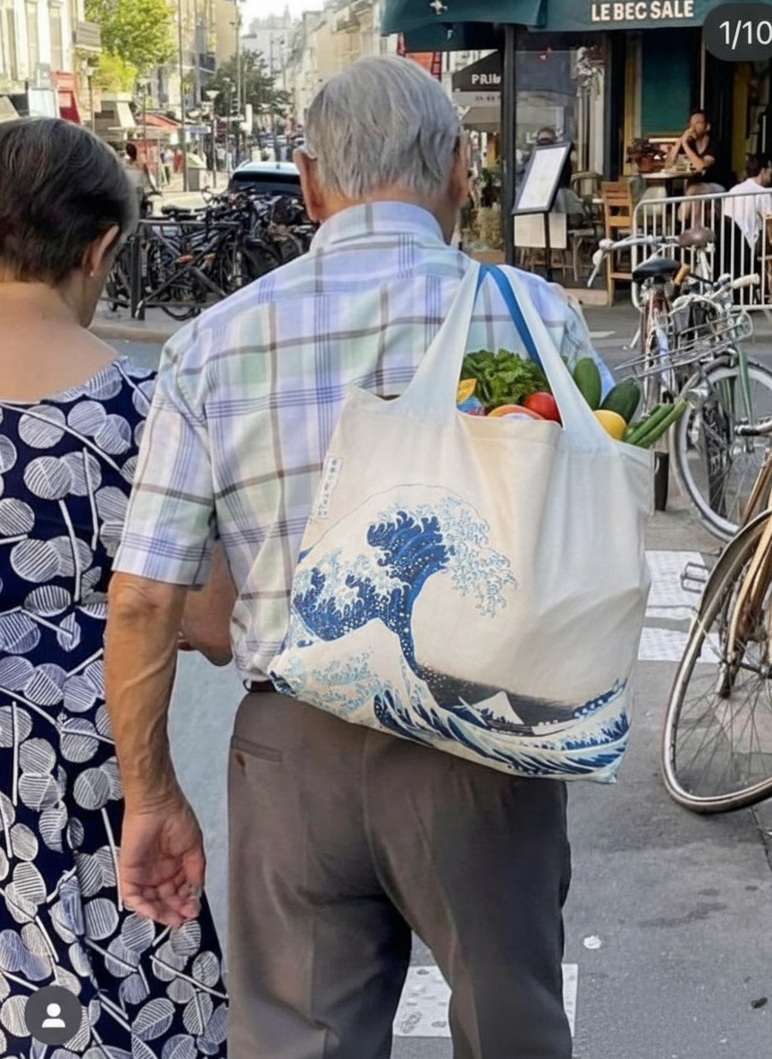 Foldable Shopper Bag The Great Wave Katsushika Hokusai – woman carrying art bag on the street | ArtyGifts
