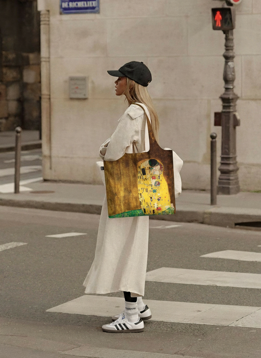 Foldable Shopper Bag The Kiss Gustav Klimt – woman carrying art bag on the street | ArtyGifts
