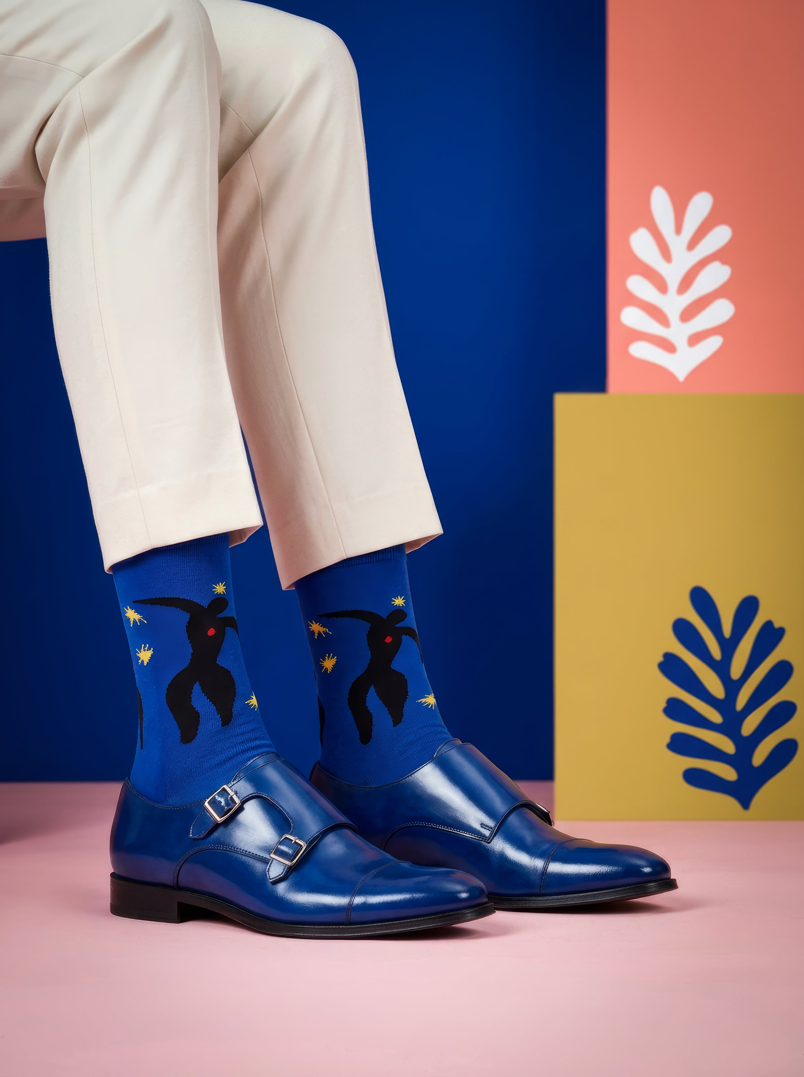 Henri Matisse Icarus art socks worn with black Chelsea boots and beige trousers – museum art gift from ArtyGifts
