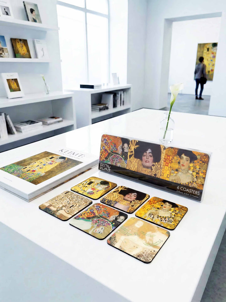 Gustav Klimt Masterpieces cork coasters on museum table with gift box — museum art gift | ArtyGifts