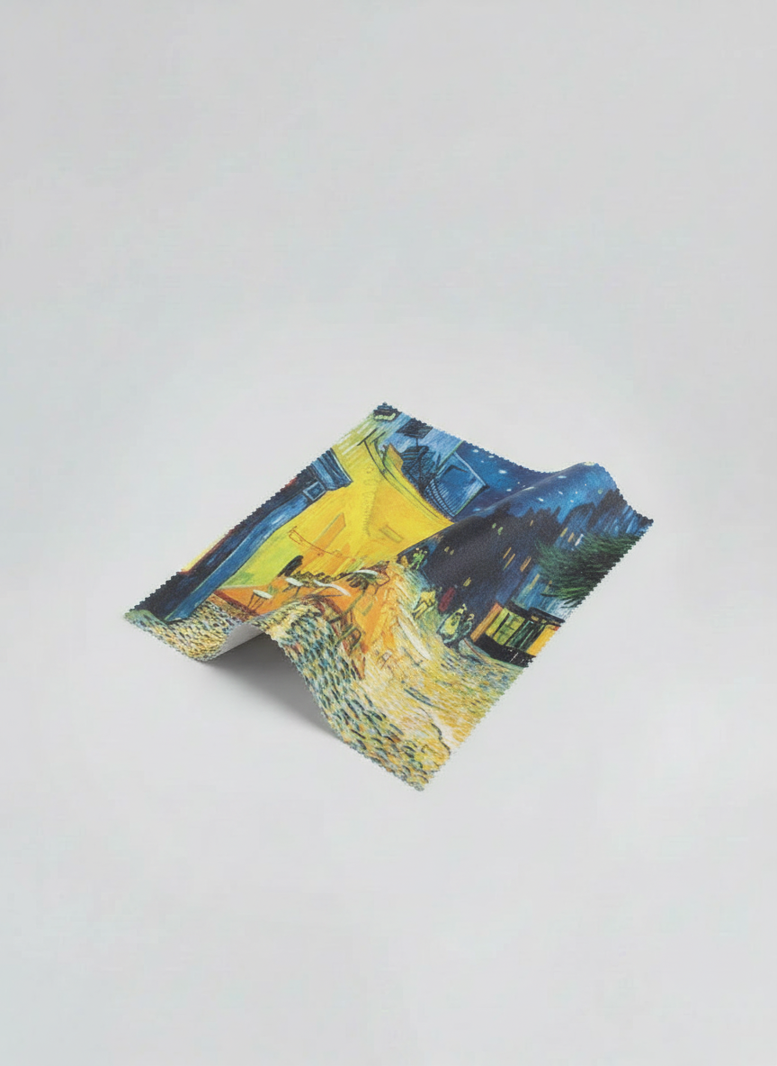 Microfiber lens cloth featuring Terrace of Café at Night by Vincent van Gogh, flat lay on white background
