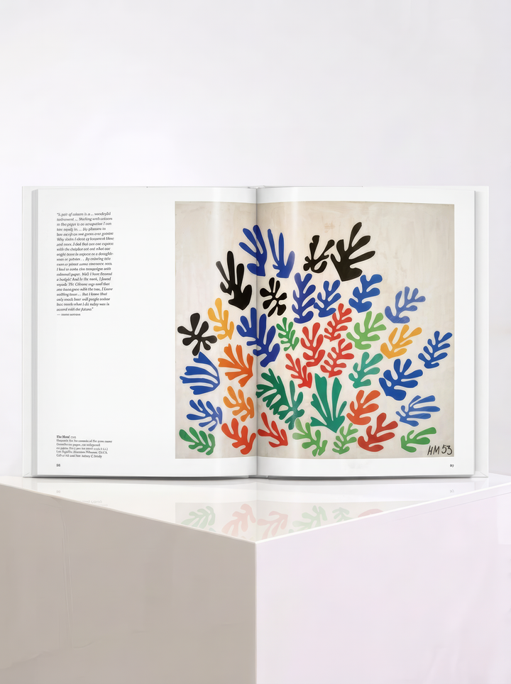Matisse Cut-outs hardcover art book by Gilles Néret, published by TASCHEN, with a colourful abstract figure on the cover, displayed on a white plinth.
