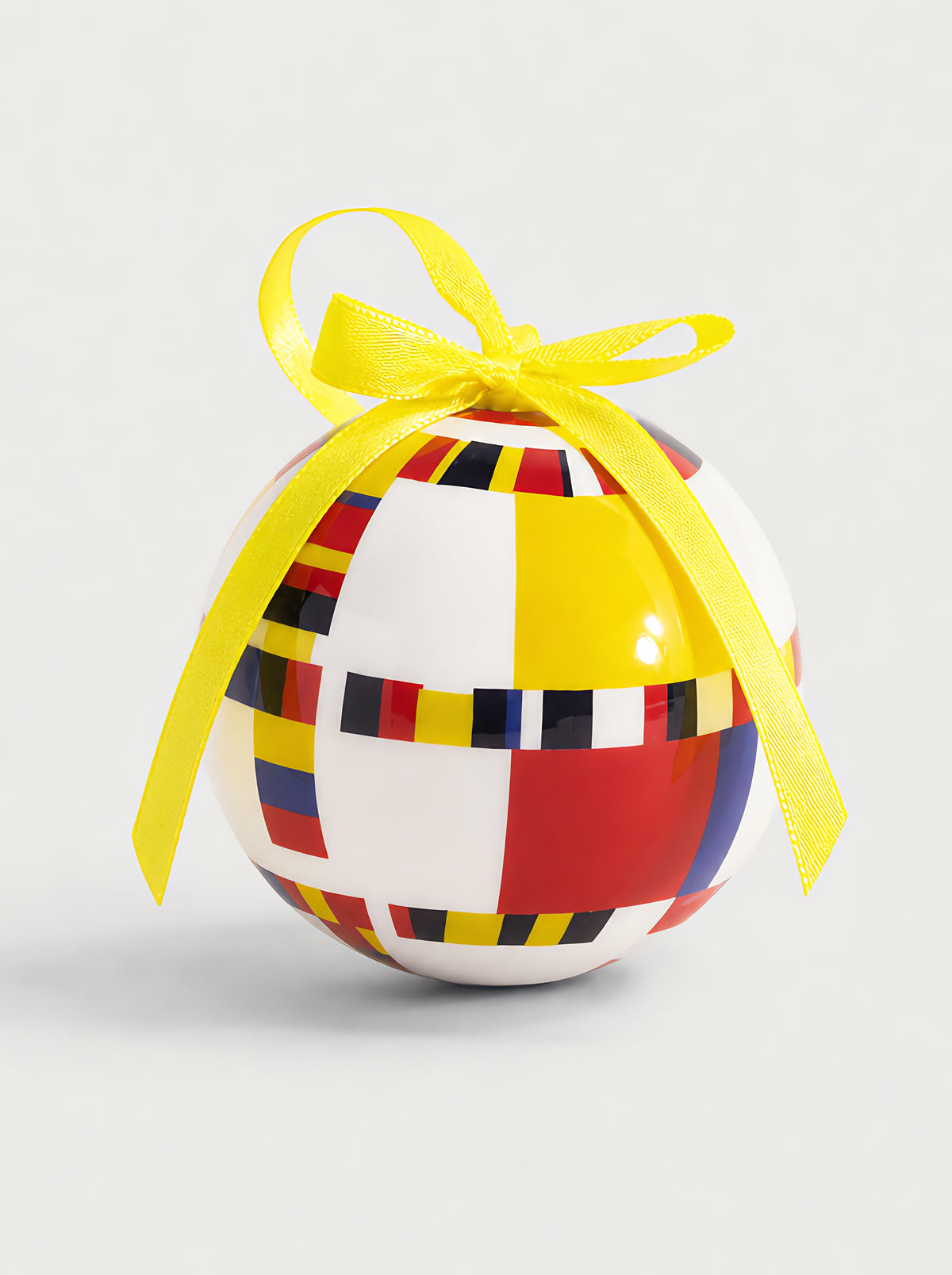 Mondrian Victory Boogie Woogie Christmas bauble close-up on grey background with yellow ribbon – officially licensed Gemeentemuseum art ornament from ArtyGifts