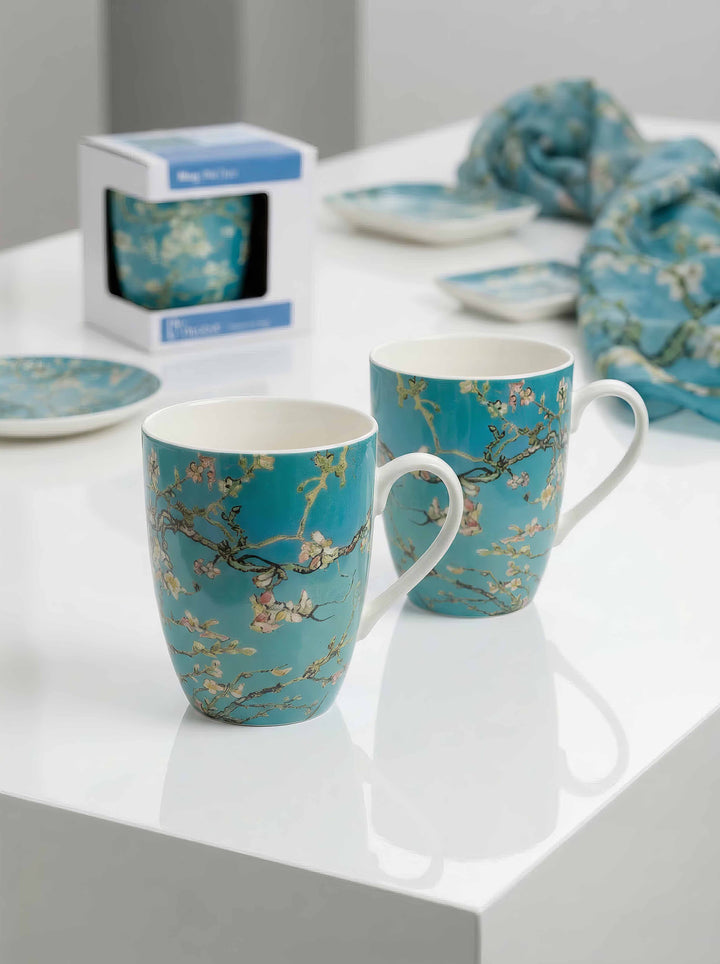 Porcelain Mug Set of 2 Almond Blossom Vincent van Gogh – two mugs on table museum display | ArtyGifts
