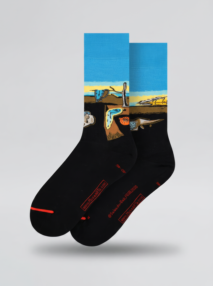 Pair of black XL socks with blue cuffs and yellow bands, featuring Salvador Dalí’s surrealist artwork, photographed against a white background.⠋

