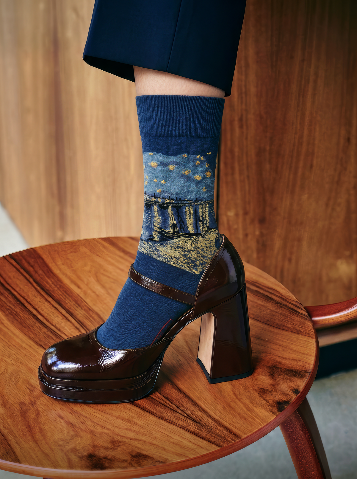 Starry Night over the Rhône art socks by Vincent van Gogh worn with glossy brown platform Mary Jane heels on a wooden table⠋