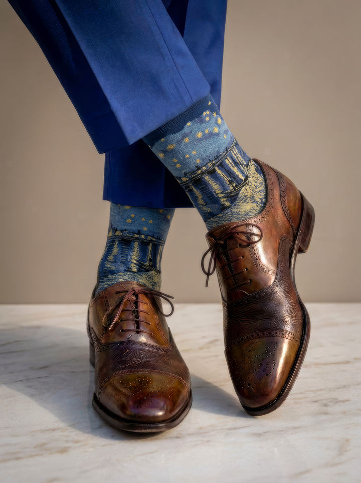 Starry Night over the Rhône art socks by Vincent van Gogh worn with polished brown leather brogue shoes and a blue suit