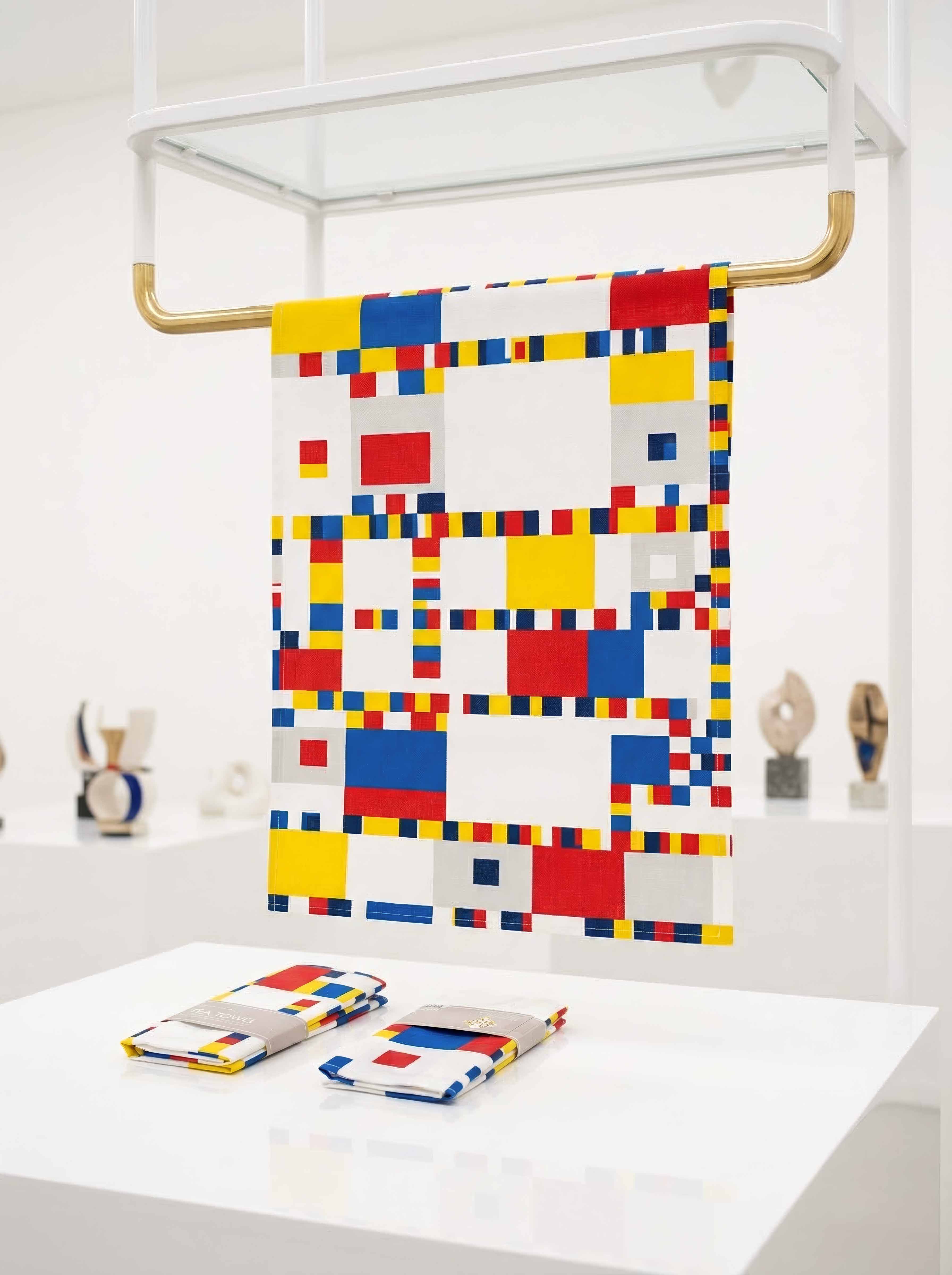 Tea Towel Set Broadway Boogie Woogie Piet Mondrian – lifestyle display on wall rack | ArtyGifts
