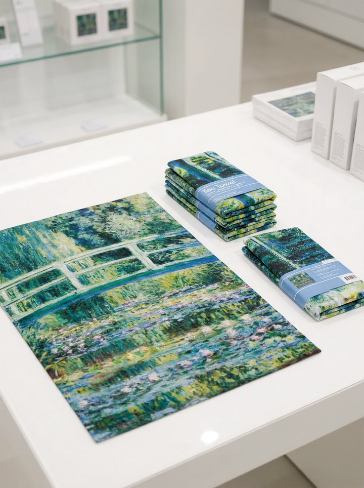Monet Japanese Bridge cotton tea towel displayed in museum shop  — museum-quality art gift by ArtyGifts
