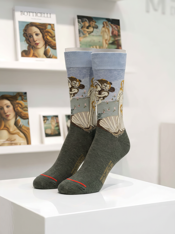 The Birth of Venus art socks featuring Botticelli’s artwork displayed on a white pedestal