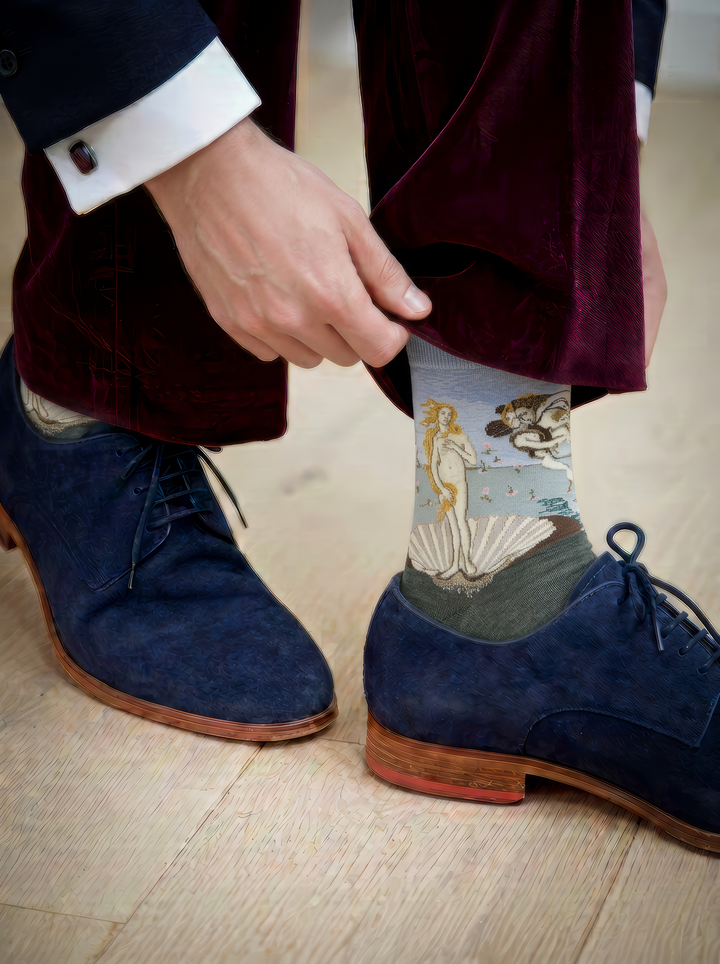 The Birth of Venus art socks featuring Botticelli’s artwork worn with blue leather shoes and dark trousers