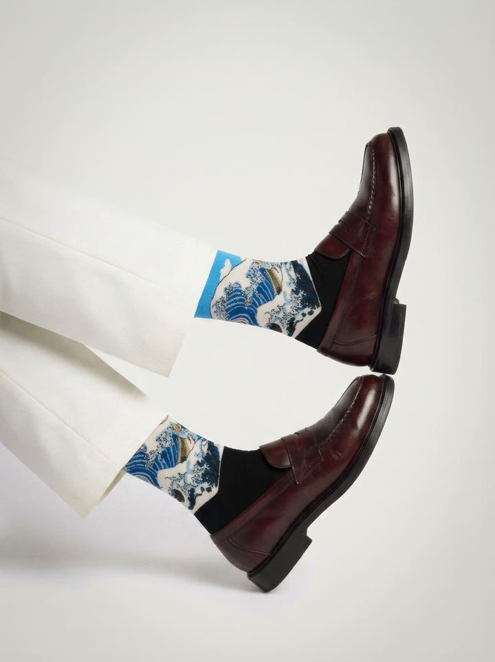 he Great Wave Blue art socks by Katsushika Hokusai styled with black high-heeled shoes on a white background