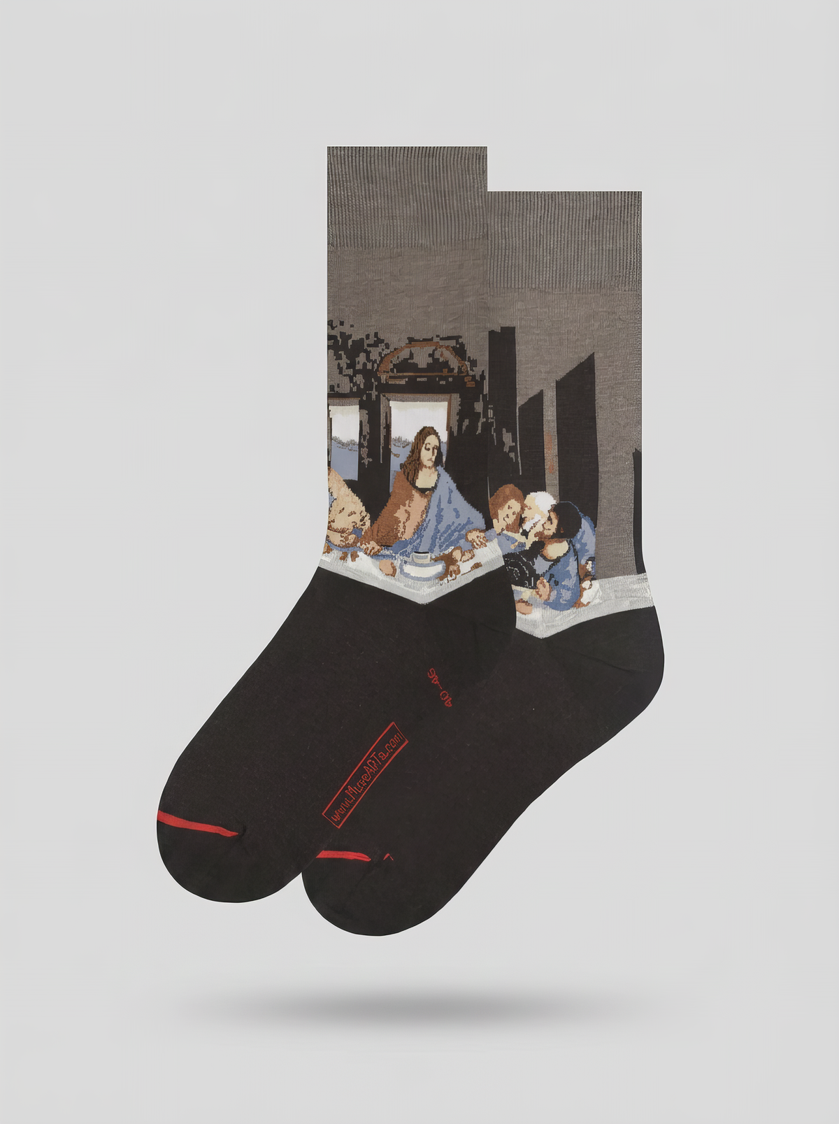 Pair of black and grey The Last Supper art socks featuring Leonardo da Vinci’s artwork shown on a white background