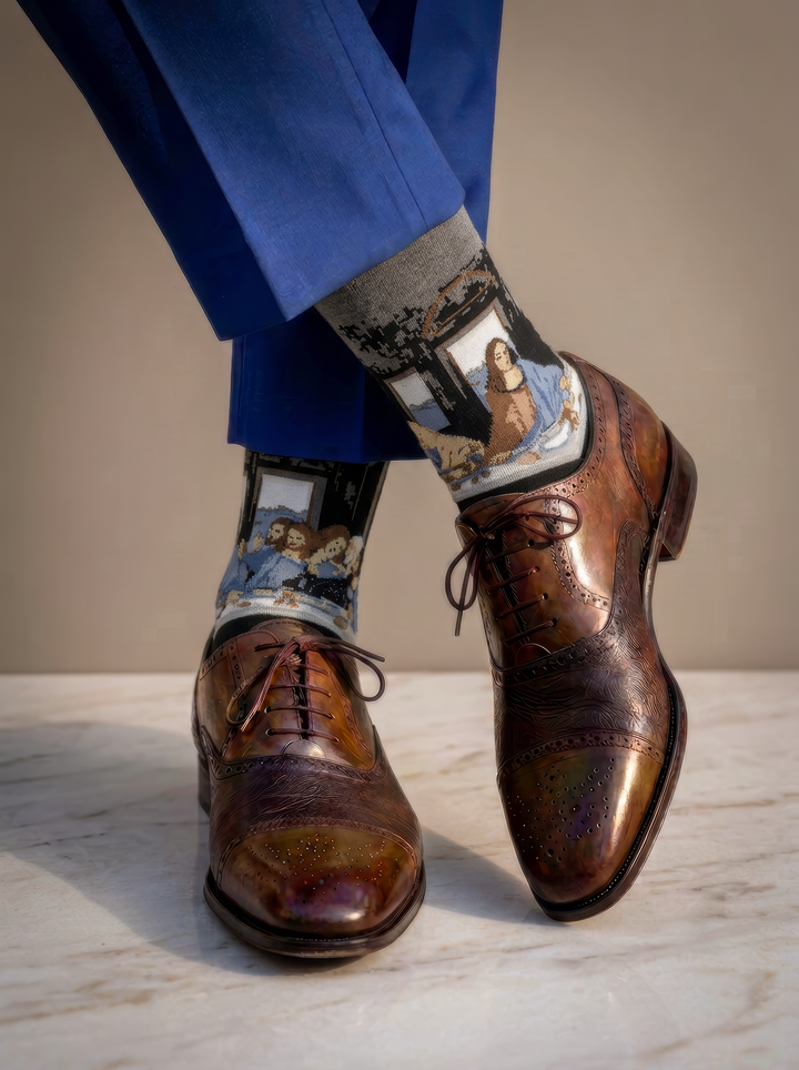 The Last Supper art socks featuring Leonardo da Vinci’s artwork worn with brown leather double monk strap shoes and blue trousers
