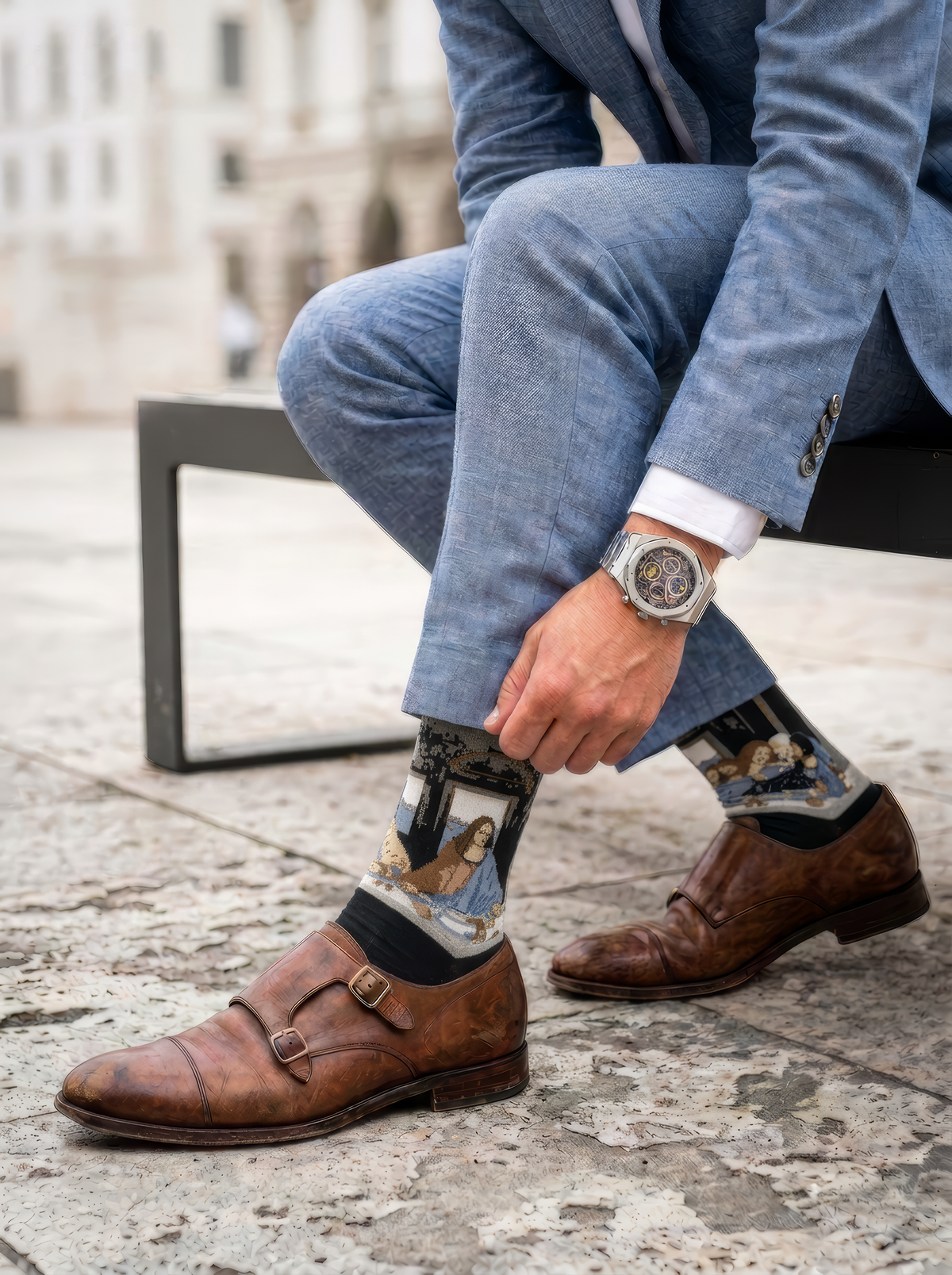 The Last Supper art socks featuring Leonardo da Vinci’s artwork worn with brown leather shoes and blue trousers outdoors