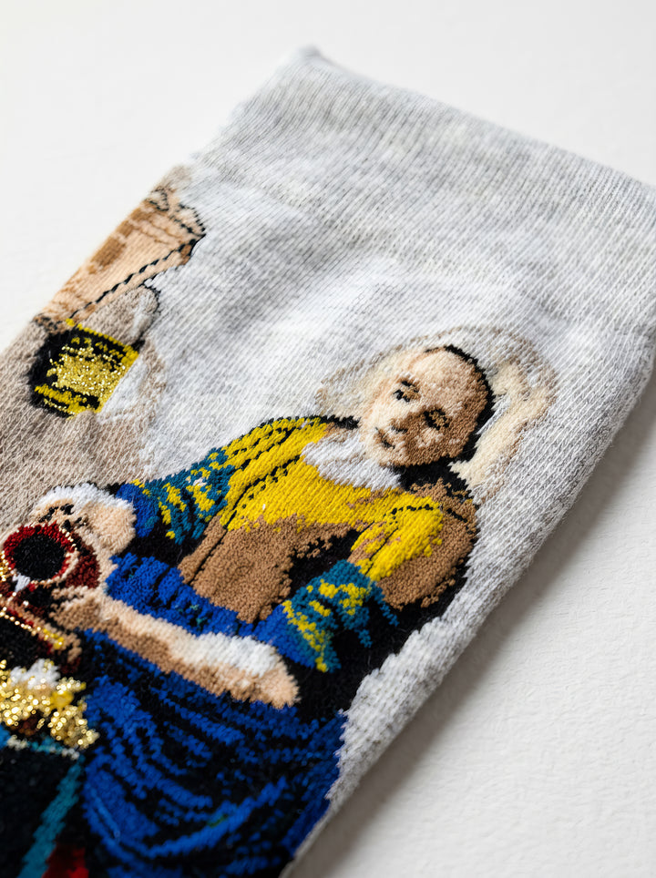 Vermeer Milkmaid art sock close-up flat lay – unisex museum gift from ArtyGifts
