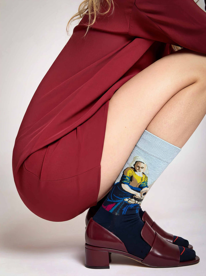 Museum-inspired Vermeer Milkmaid socks worn with burgundy heeled shoes
