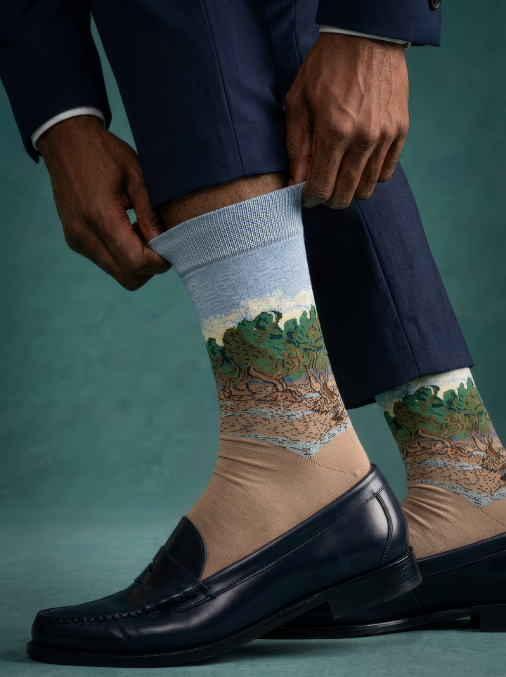 The Olive Trees art socks by Vincent van Gogh worn with black leather loafers and navy trousers