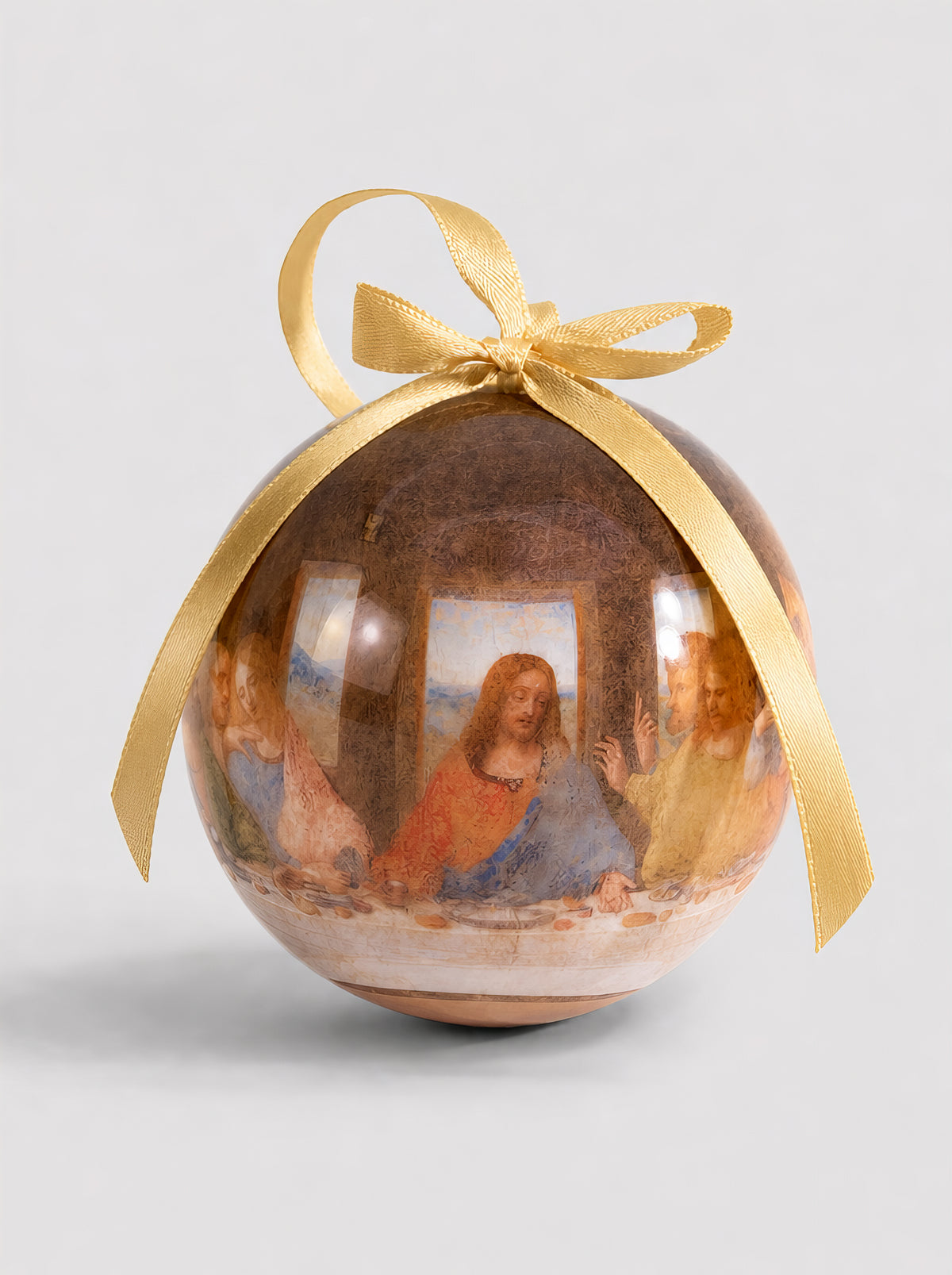 Close-up of a Leonardo da Vinci Last Supper Christmas bauble with gold ribbon on a white background – officially licensed museum art ornament, 7 cm, unbreakable, in gift box. A unique religious art Christmas gift from ArtyGifts.