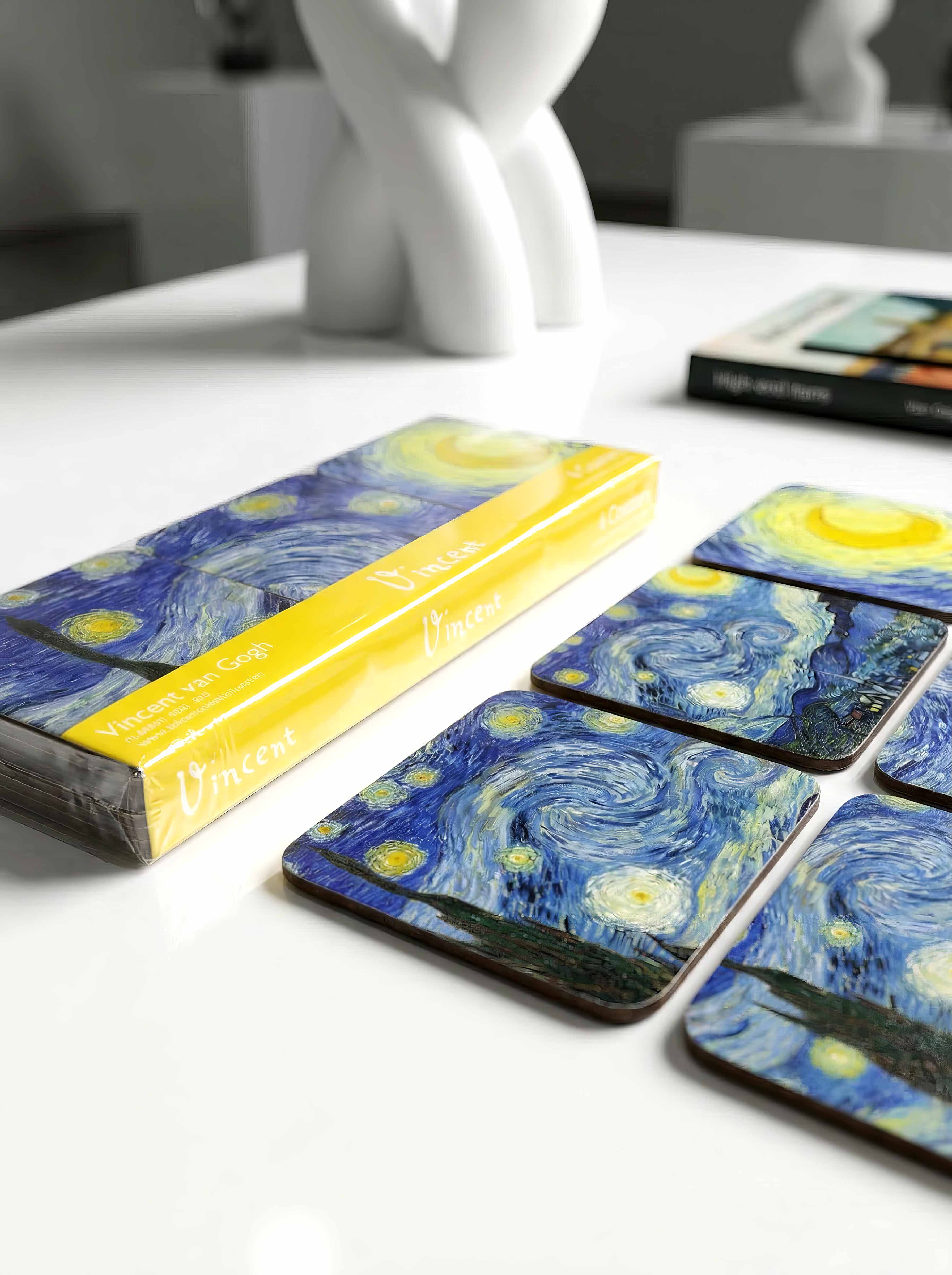 Van Gogh Starry Night cork coasters on table with gift box — museum art souvenir | ArtyGifts