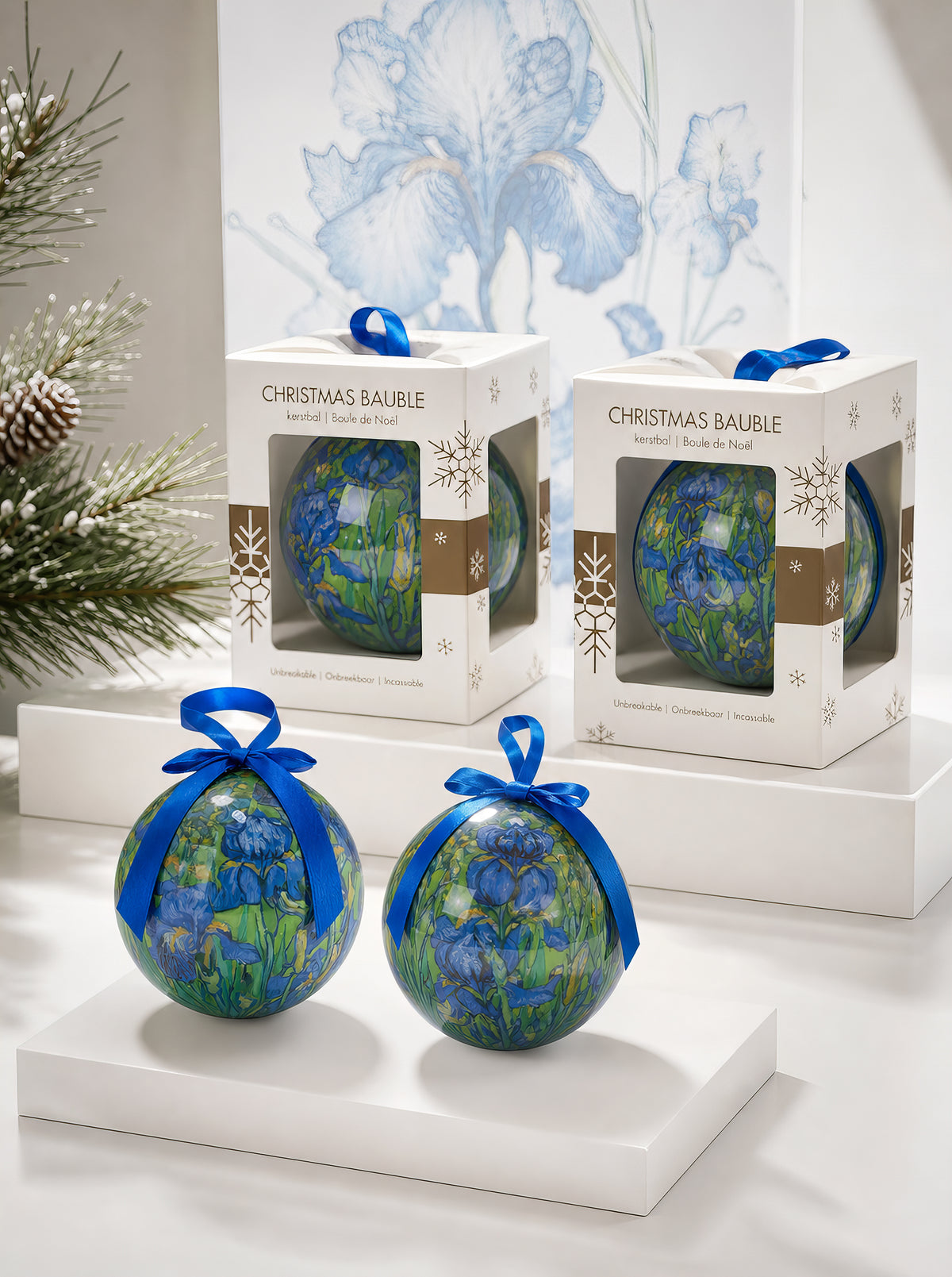 Van Gogh Irises Christmas baubles with gift boxes in front of Irises painting – officially licensed museum art ornament from ArtyGifts