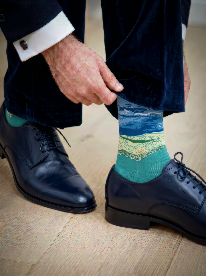 Wheat Field under Thunderstorm Sky unisex art socks by Vincent van Gogh worn with navy leather lace-up dress shoes and a navy suit⠋

