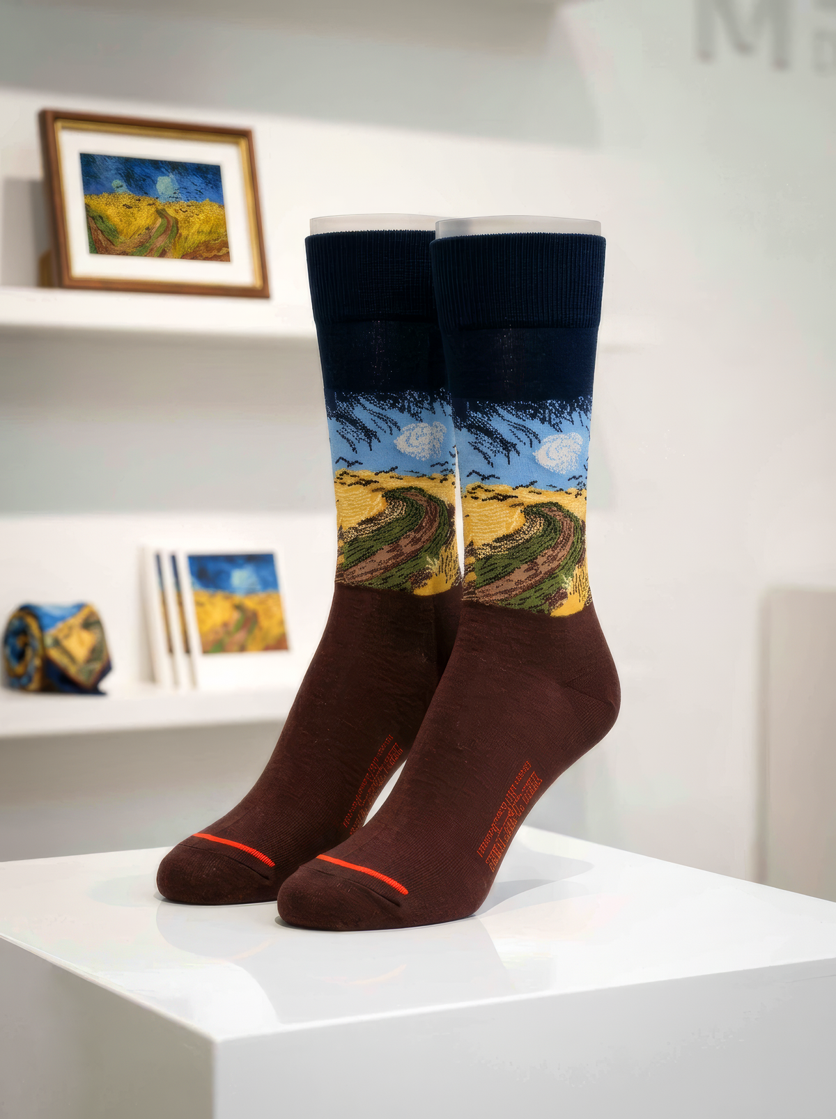 Wheatfield with Crows art socks by Vincent van Gogh displayed on a white pedestal in an art-filled interior