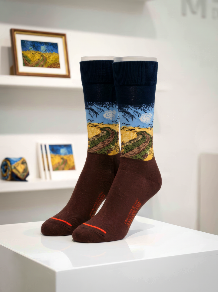 Wheatfield with Crows art socks by Vincent van Gogh displayed on a white pedestal in an art-filled interior