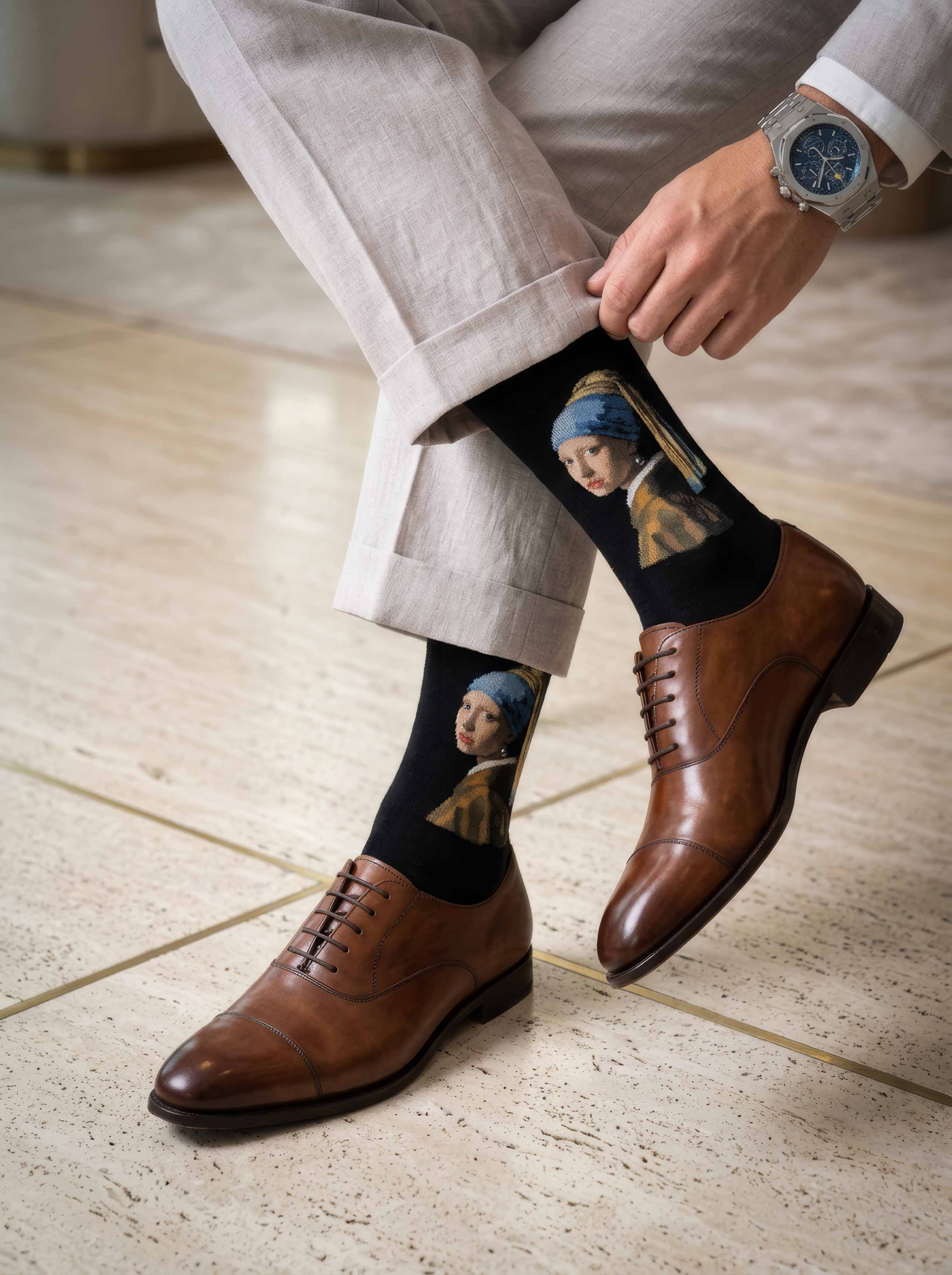 Man wearing MuseARTa Vermeer Girl with the Pearl Earring art socks with brown Oxford shoes — elegant art gift ArtyGifts