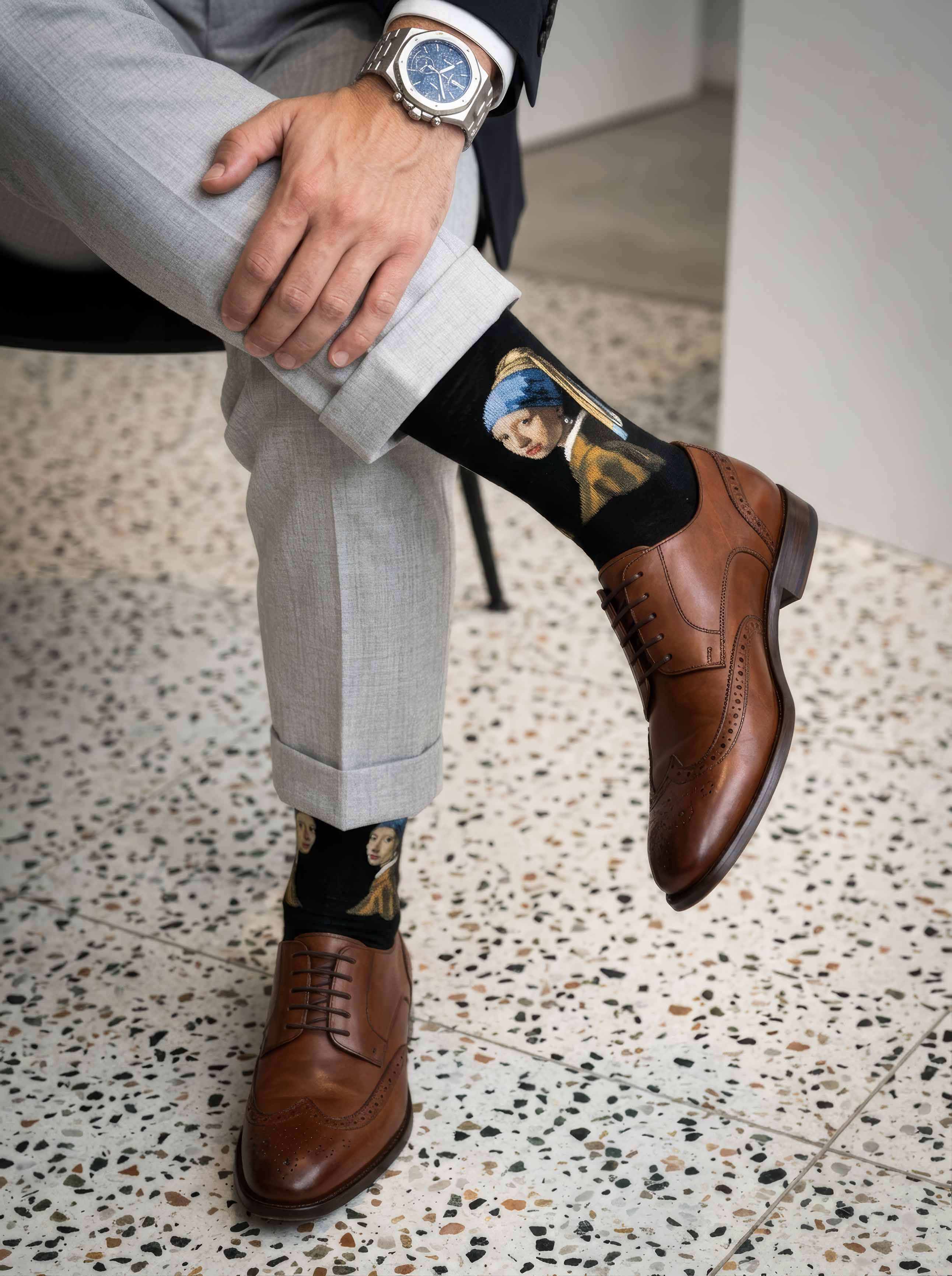 Man wearing MuseARTa Vermeer Girl with the Pearl Earring art socks with brown Oxford shoes and luxury watch — premium art gift ArtyGifts