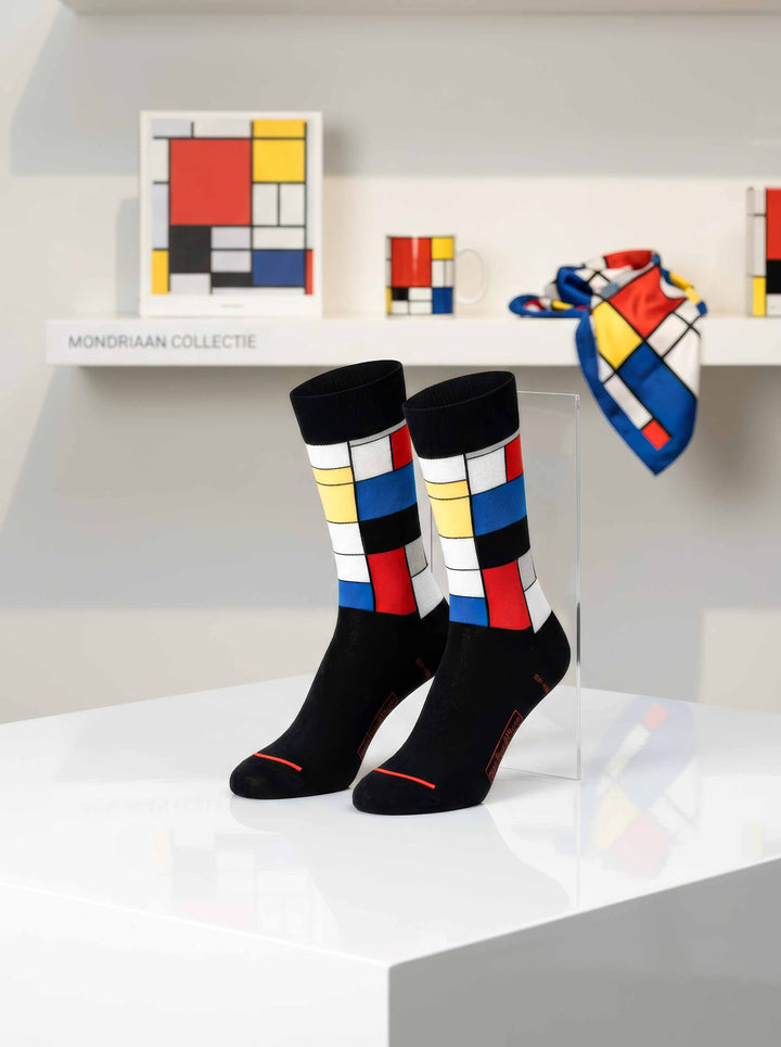 MuseARTa Mondrian Composition art socks displayed in museum setting with Mondrian artworks — ArtyGifts