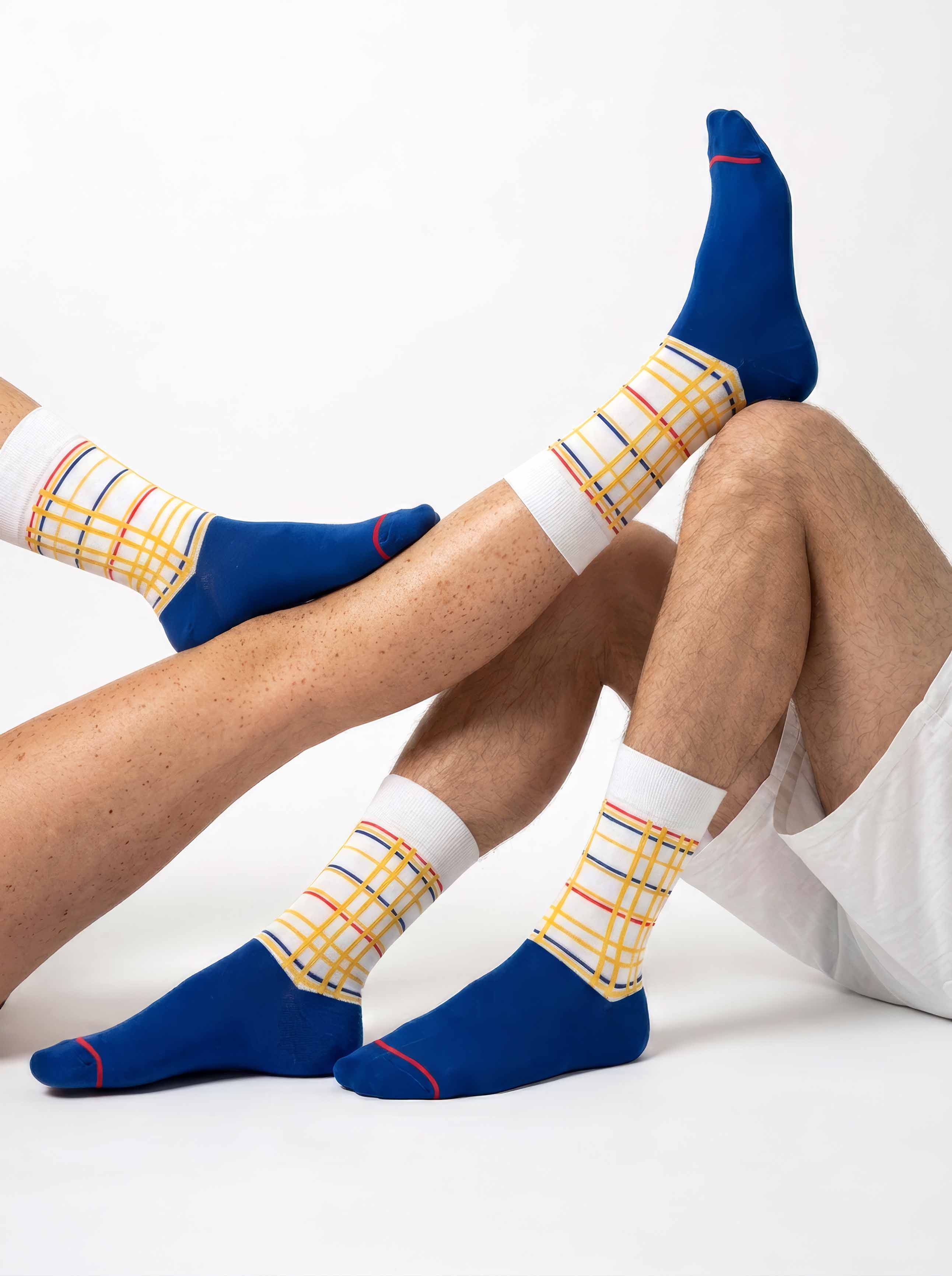 Unisex MuseARTa Mondrian New York City art socks worn by man and woman — De Stijl museum gift ArtyGifts

