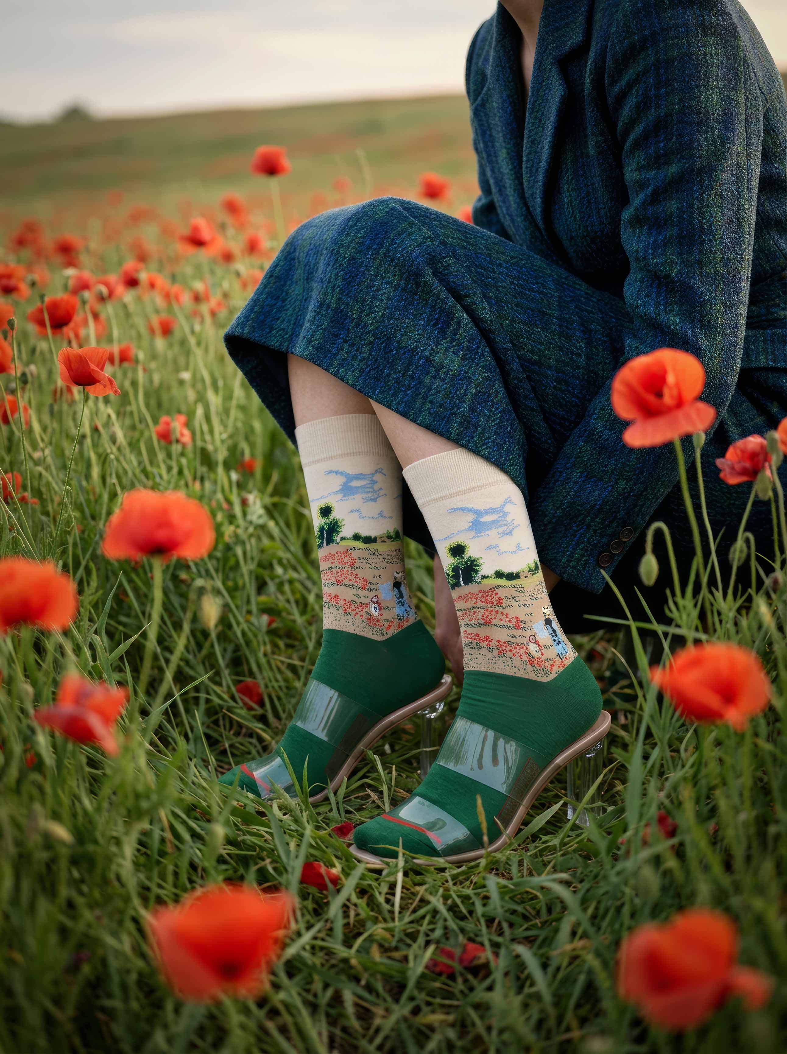 Woman in blue dress wearing MuseARTa Monet Field of Poppies art socks in poppy field — Impressionist Musée d'Orsay Paris gift ArtyGifts
