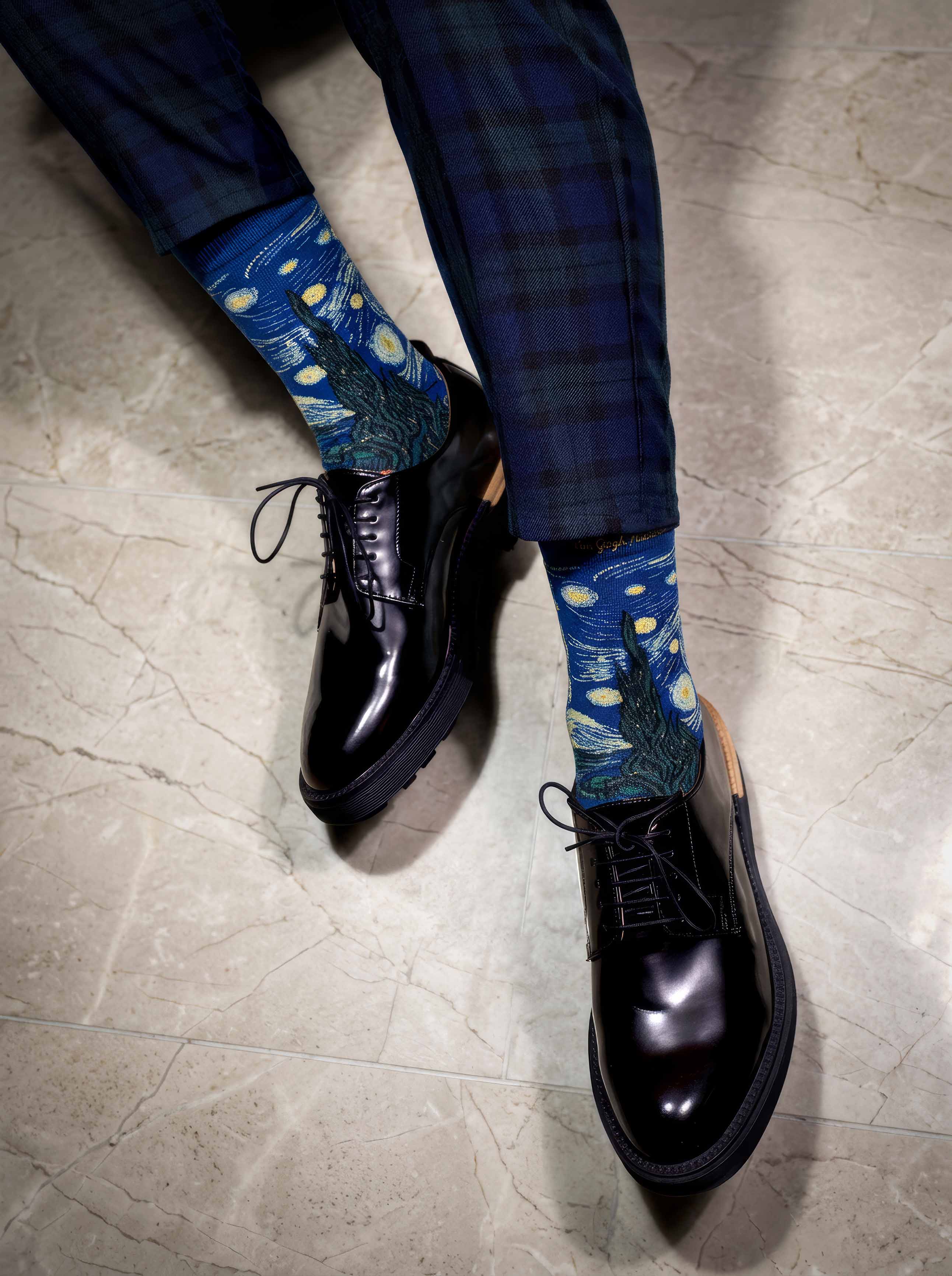 Man wearing MuseARTa Van Gogh Starry Night art socks with black Oxford shoes — premium museum gift ArtyGifts
