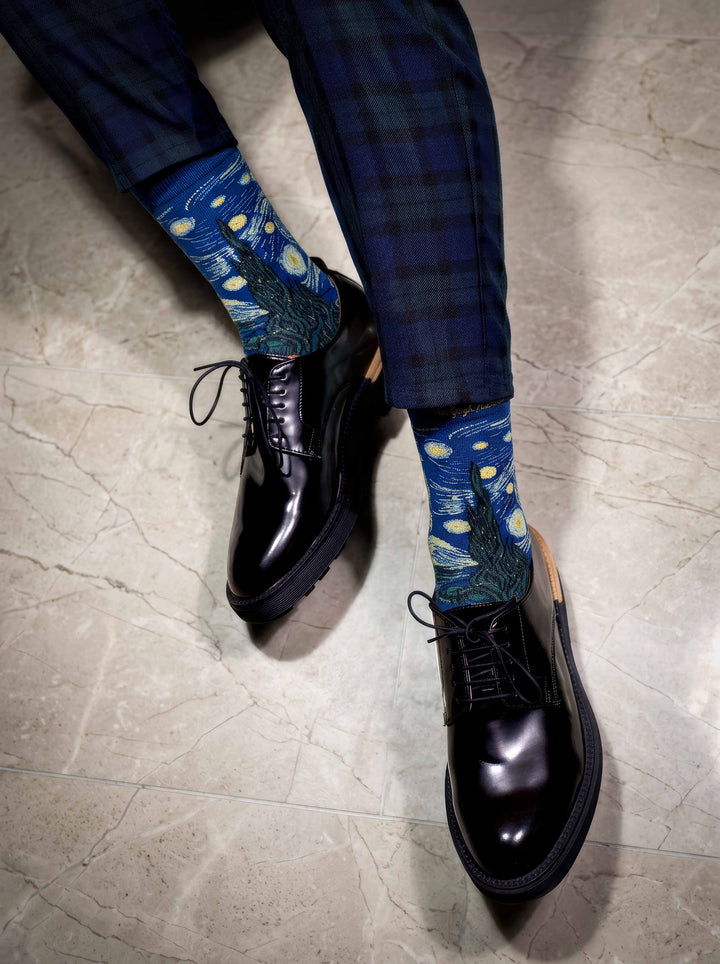 Man wearing MuseARTa Van Gogh Starry Night art socks with black Oxford shoes — premium museum gift ArtyGifts
